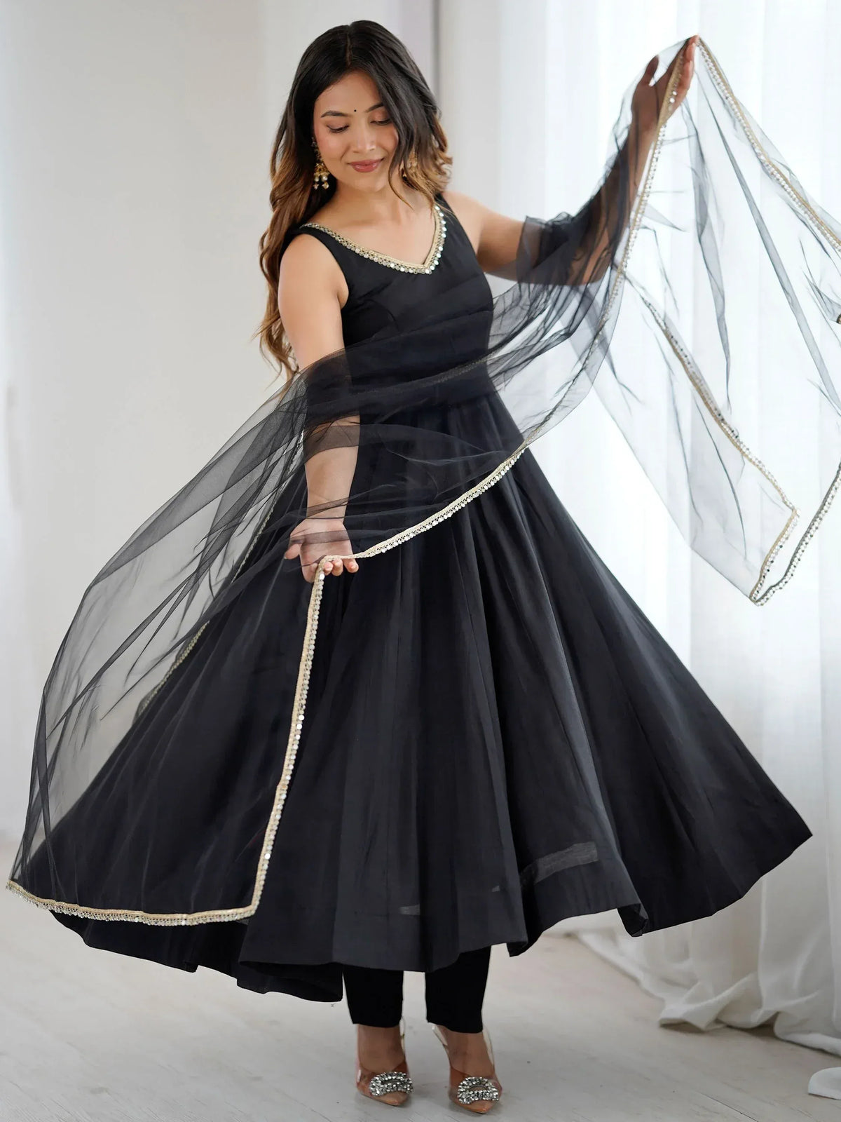 Black ethnic gown with sheer dupatta, perfect for Indian occasions and festive events.