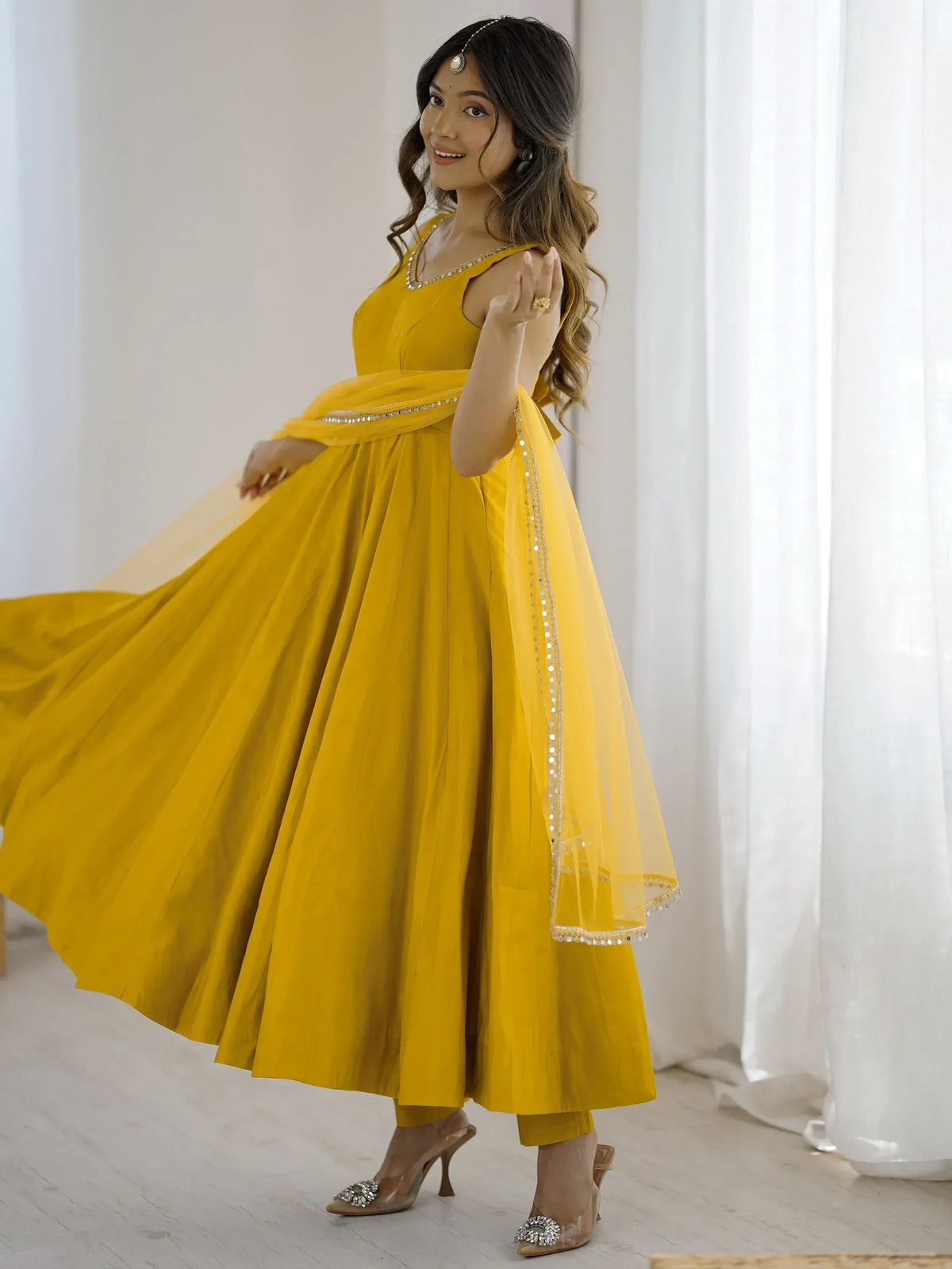 Yellow ethnic anarkali suit with sequin dupatta, perfect for Indian weddings and festive occasions