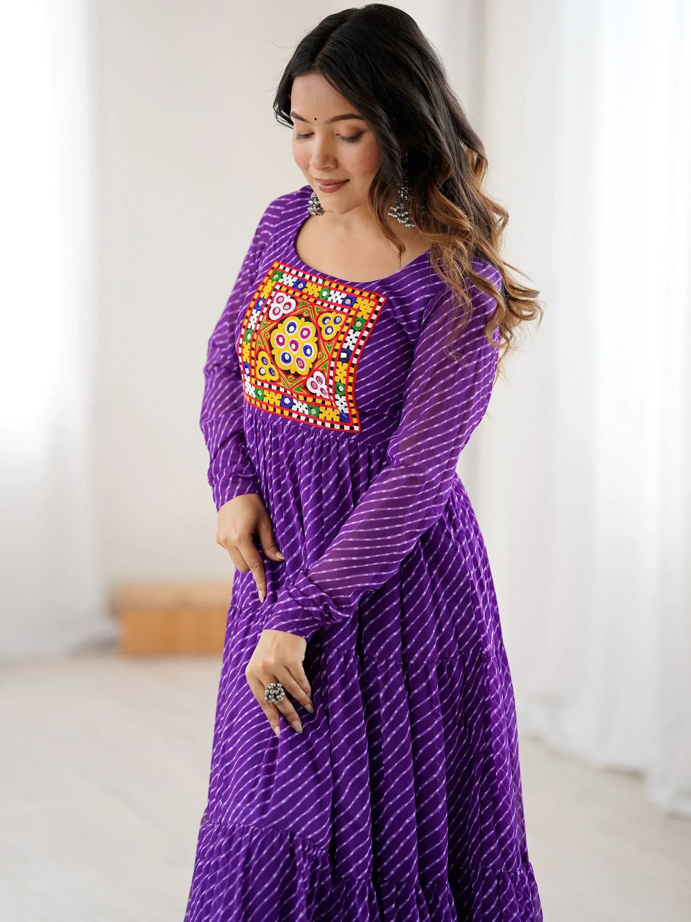 Purple ethnic gown with colorful mirror work, long sleeves, and striped print for women