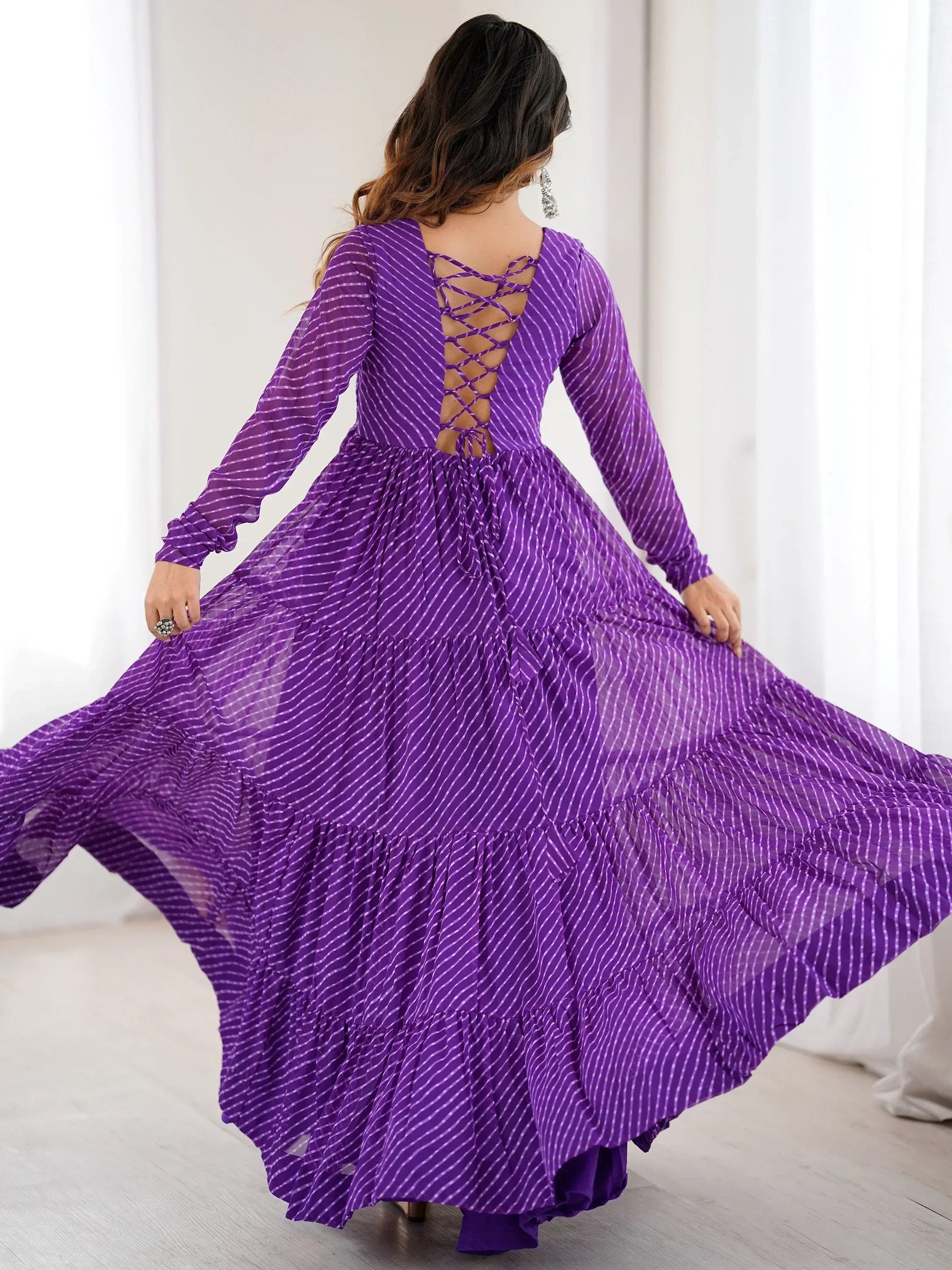 Purple striped ethnic gown with crisscross back, long sleeves, and flared tiered skirt for women