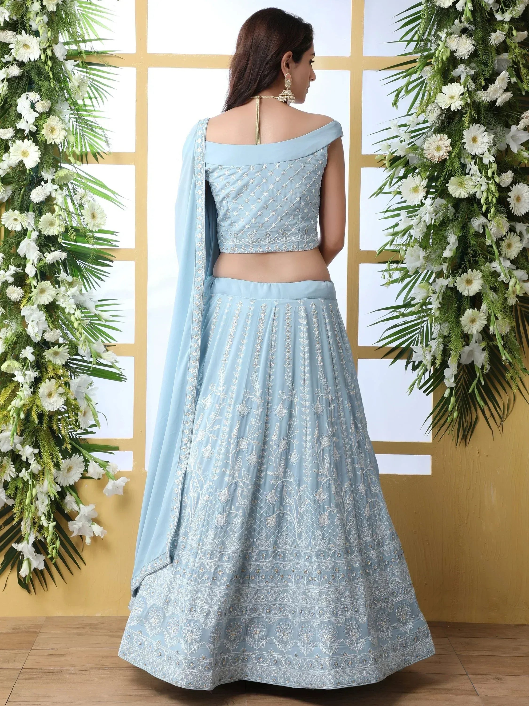 Light blue embroidered lehenga choli with off-shoulder blouse, perfect for Indian ethnic wear occasions