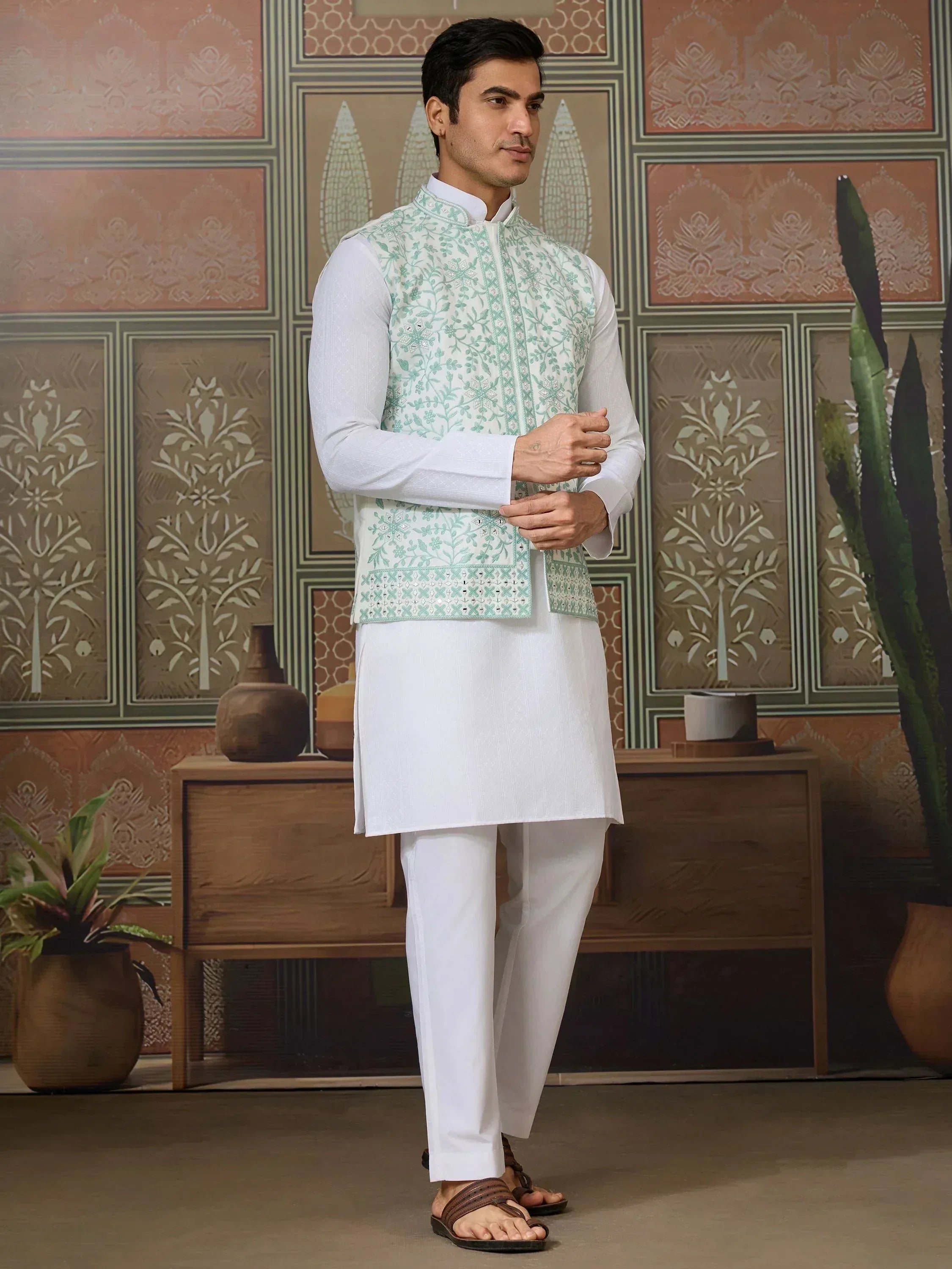 Men's white kurta set with mint green embroidered vest, ethnic Indian wear for festive occasions