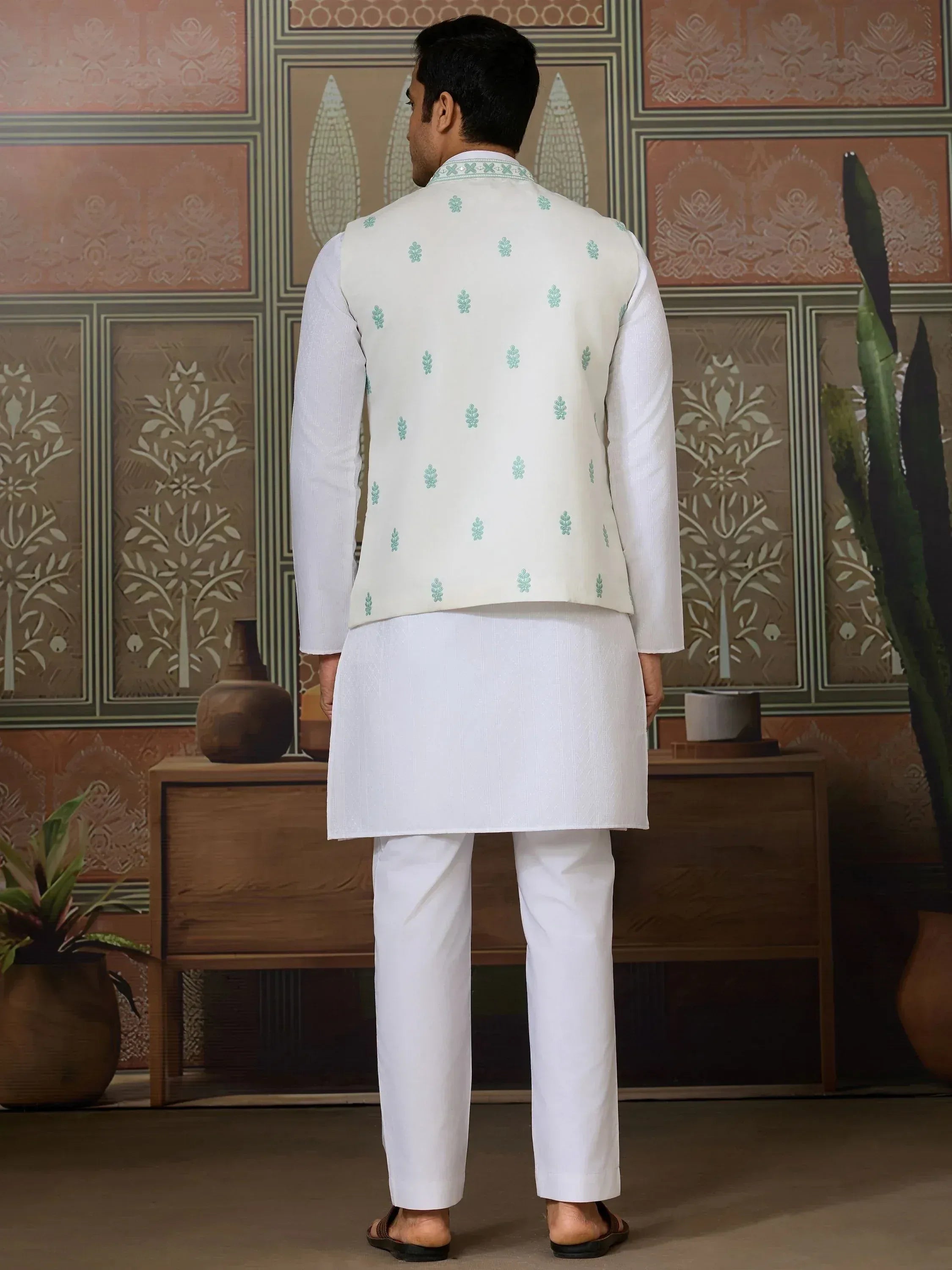 White kurta pajama with mint green embroidered vest, traditional Indian men's ethnic wear
