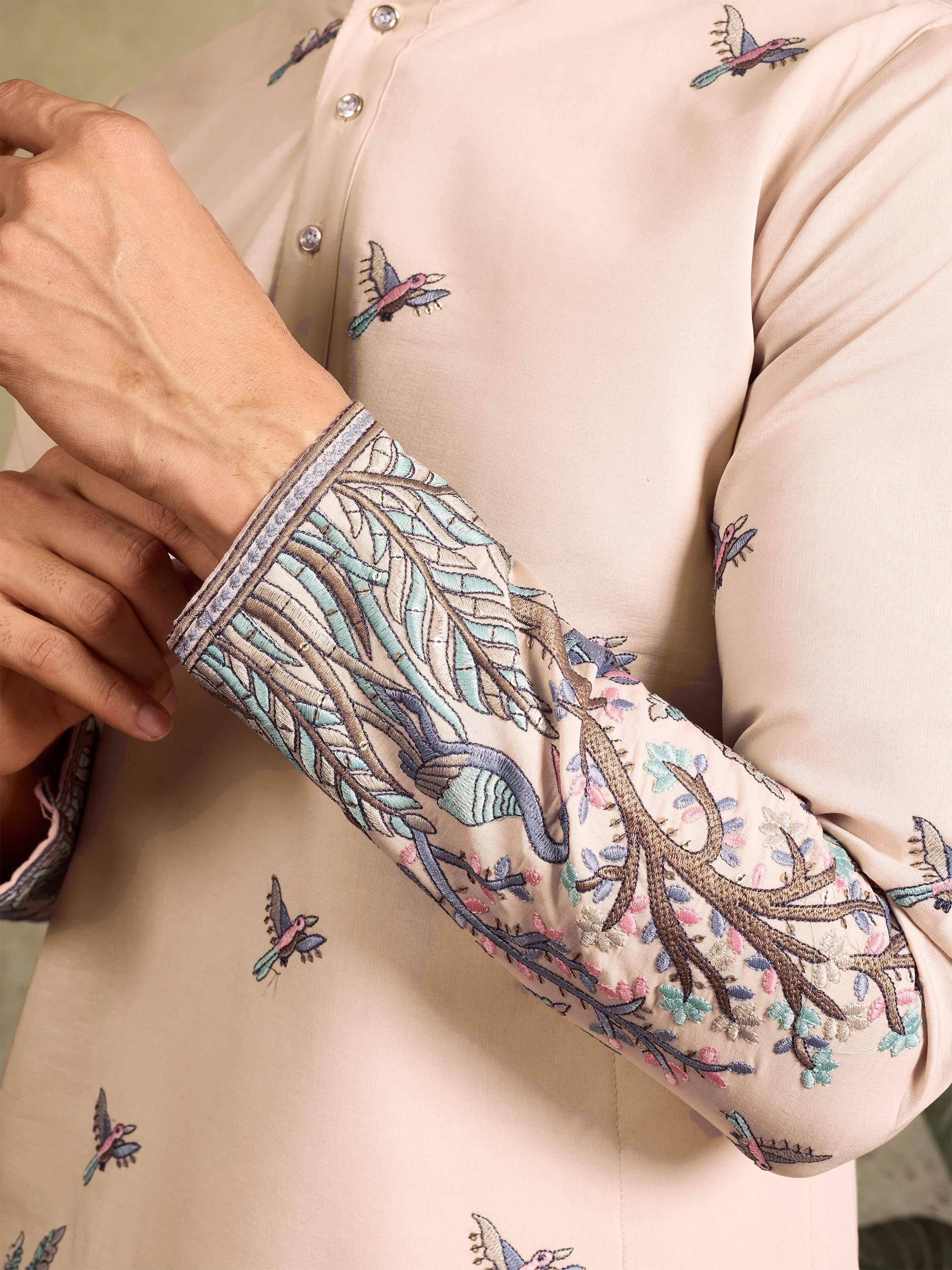Beige ethnic kurta with bird and floral embroidery, detailed sleeve design