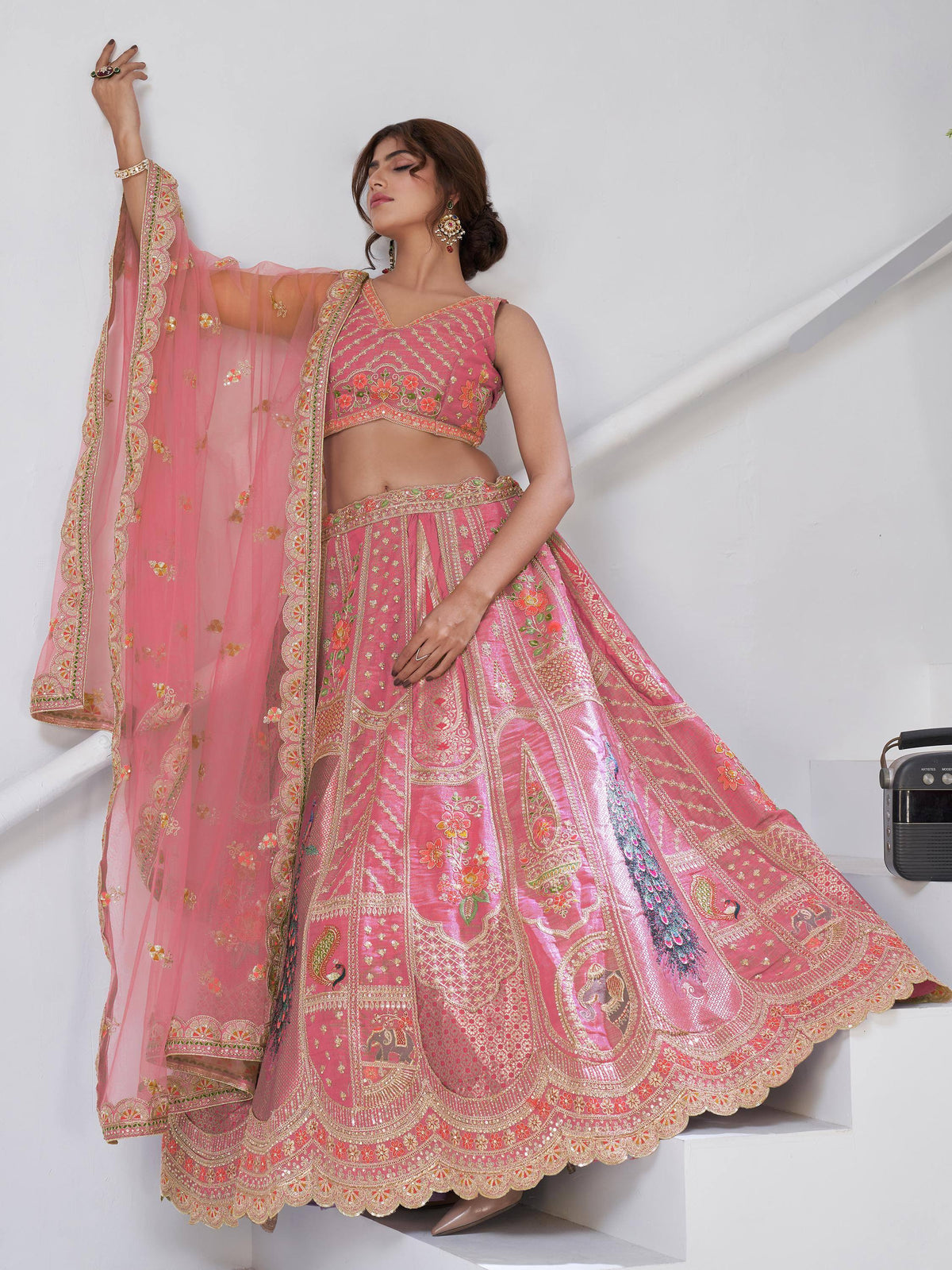 Pink embroidered lehenga choli with peacock motifs and floral designs, perfect for Indian ethnic wear.