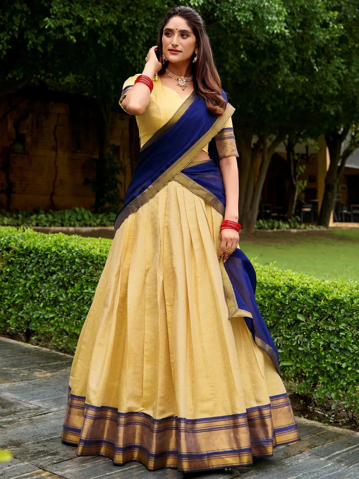 Yellow and navy blue designer lehenga choli with gold border, perfect for Indian ethnic wear occasions