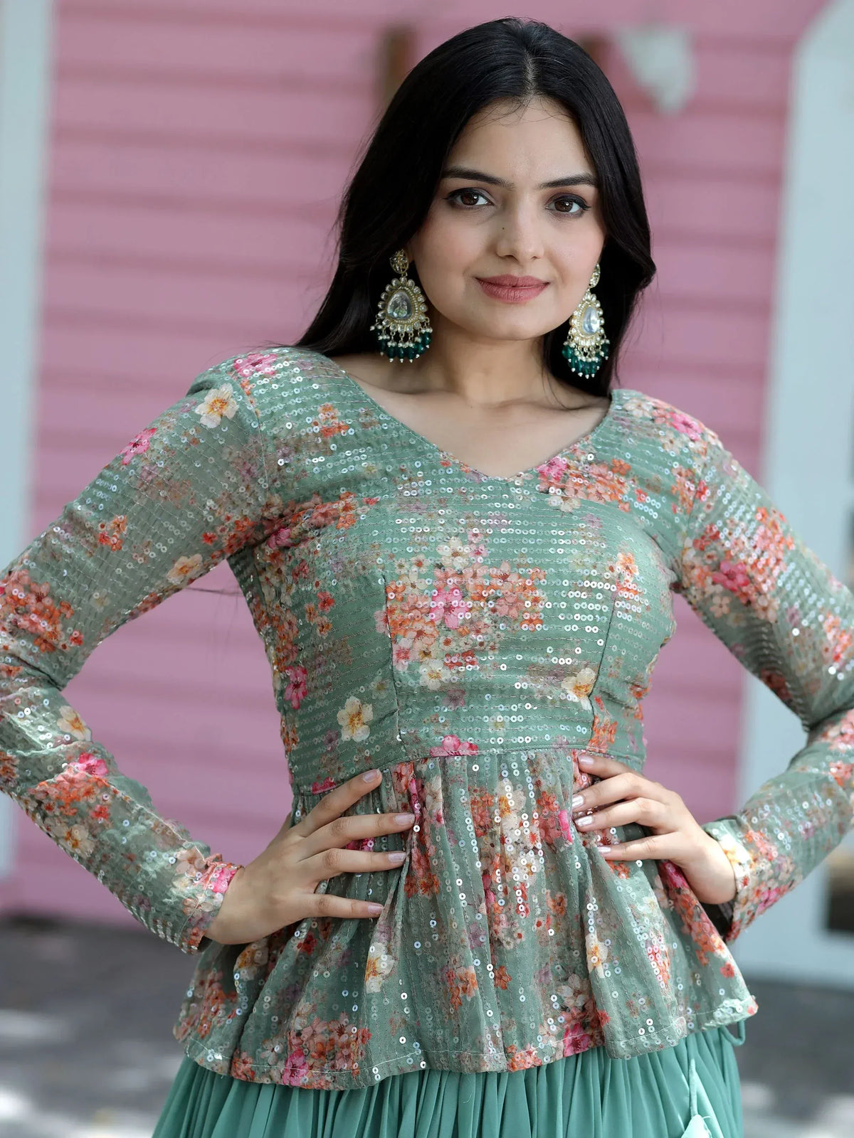 Green floral sequin ethnic gown with peplum top and pleated skirt, perfect for Indian occasions