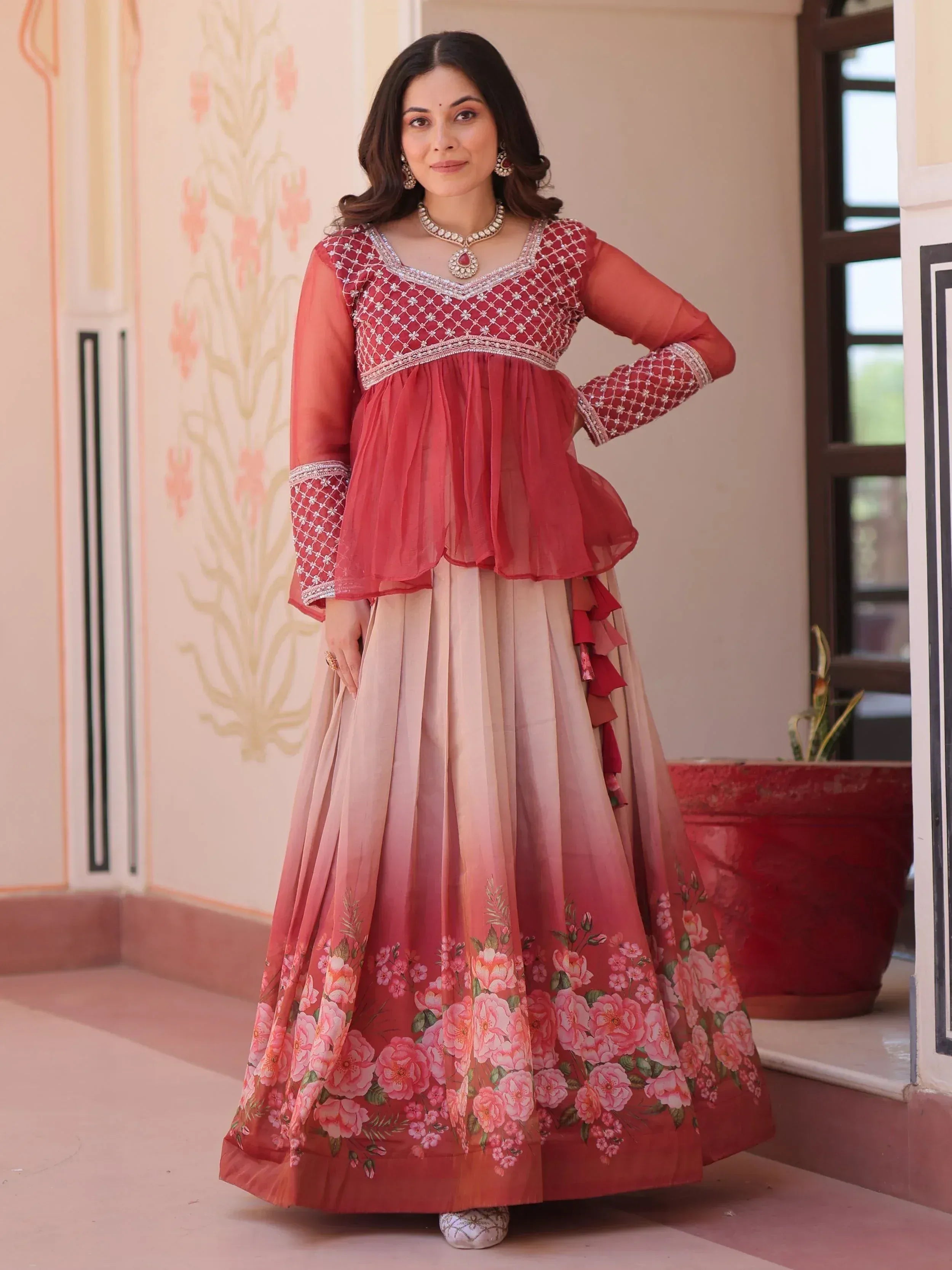 Woman in red embroidered lehenga choli with floral skirt, Indian ethnic wear