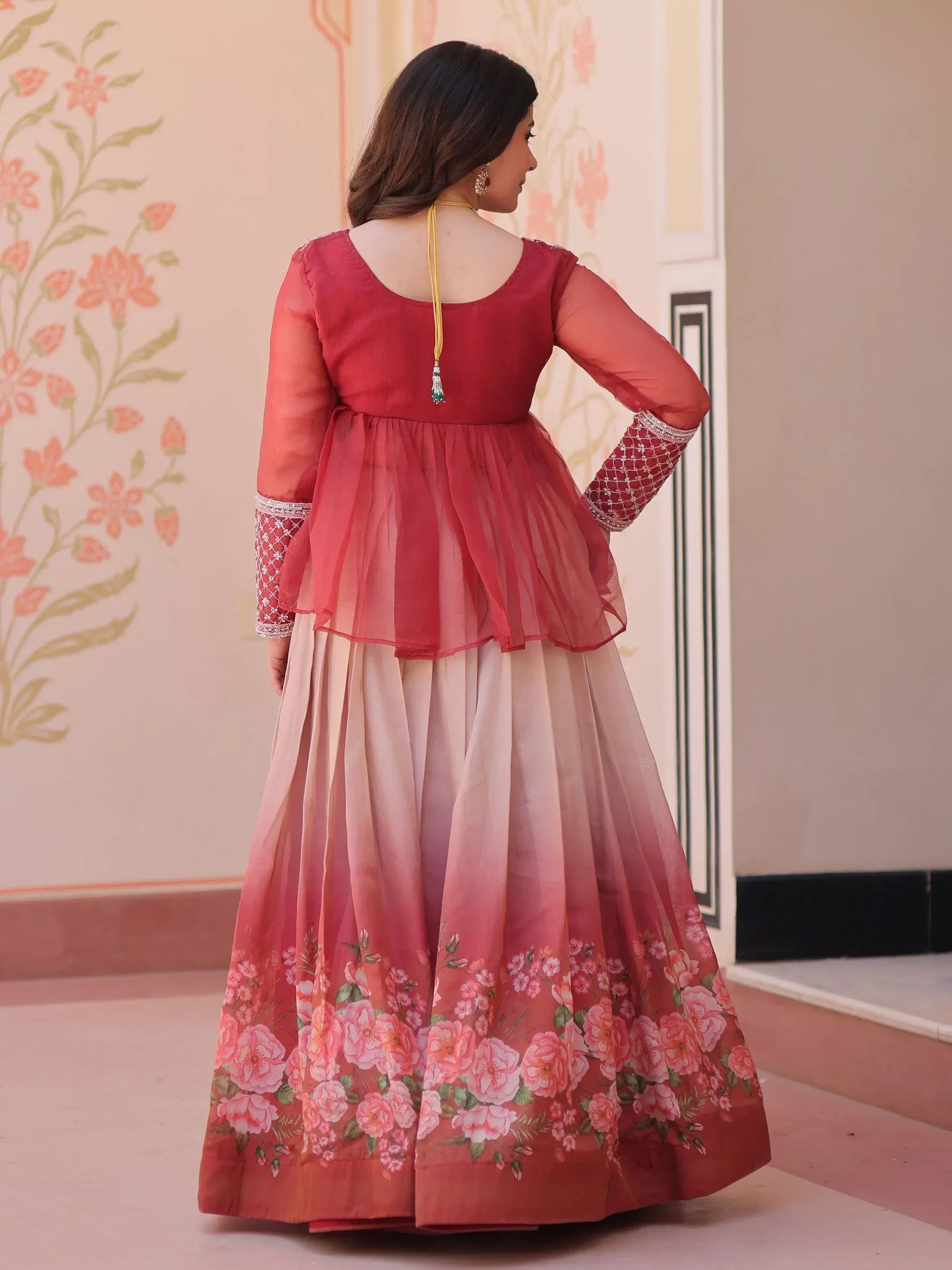 Pink floral print ethnic gown with sheer sleeves and peplum top, perfect for Indian occasions