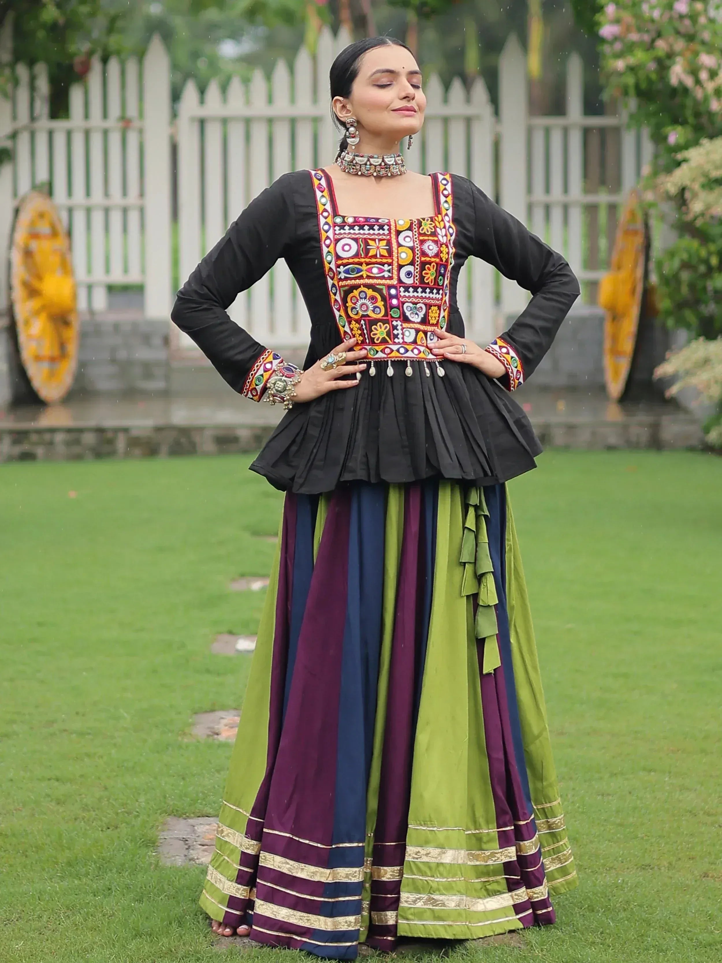 Black embroidered top with colorful patchwork and striped green purple skirt, Indian ethnic wear