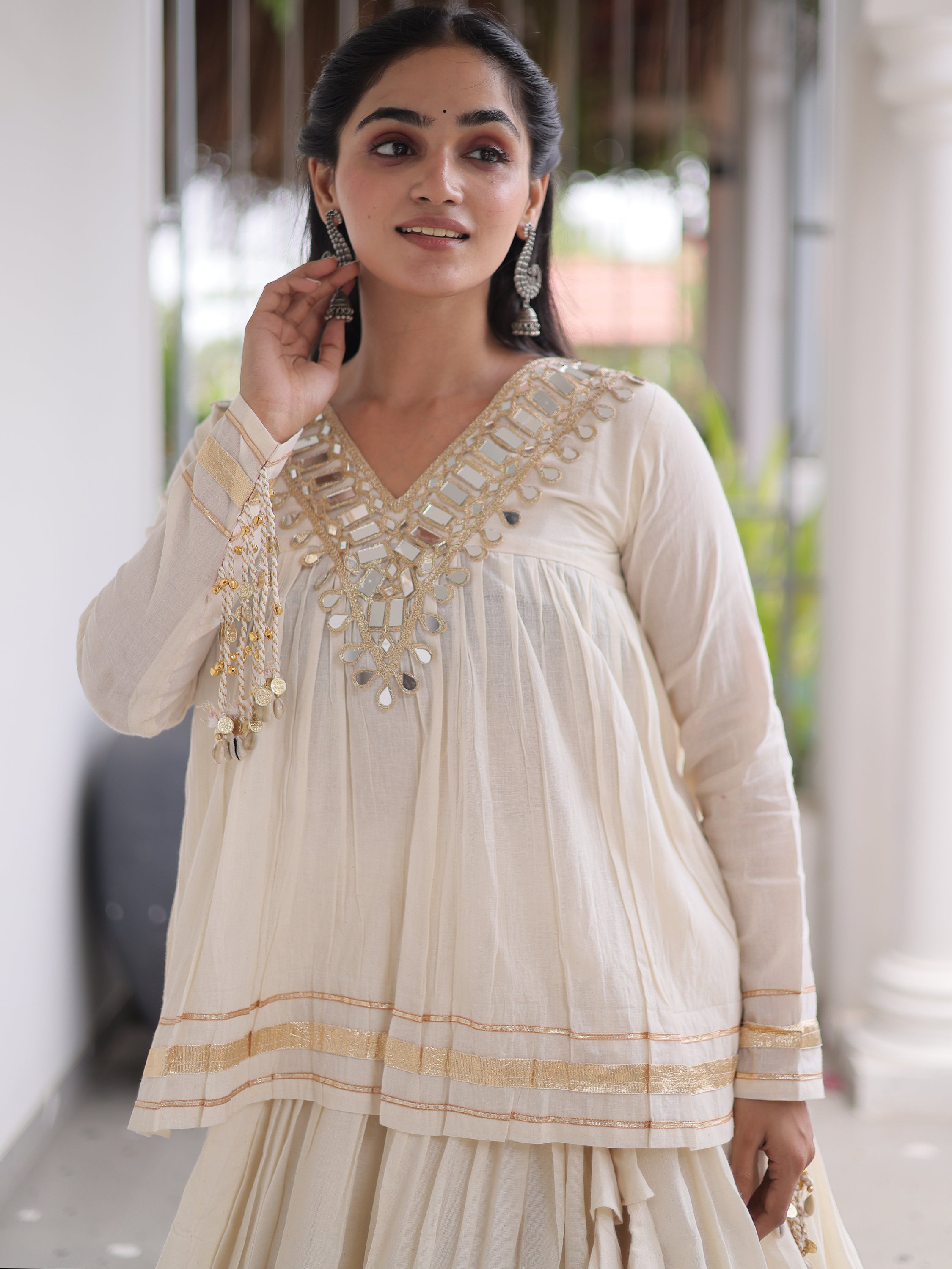 Alluring White Mirror Laced Navratri Wear Lehenga With Peplum Top
