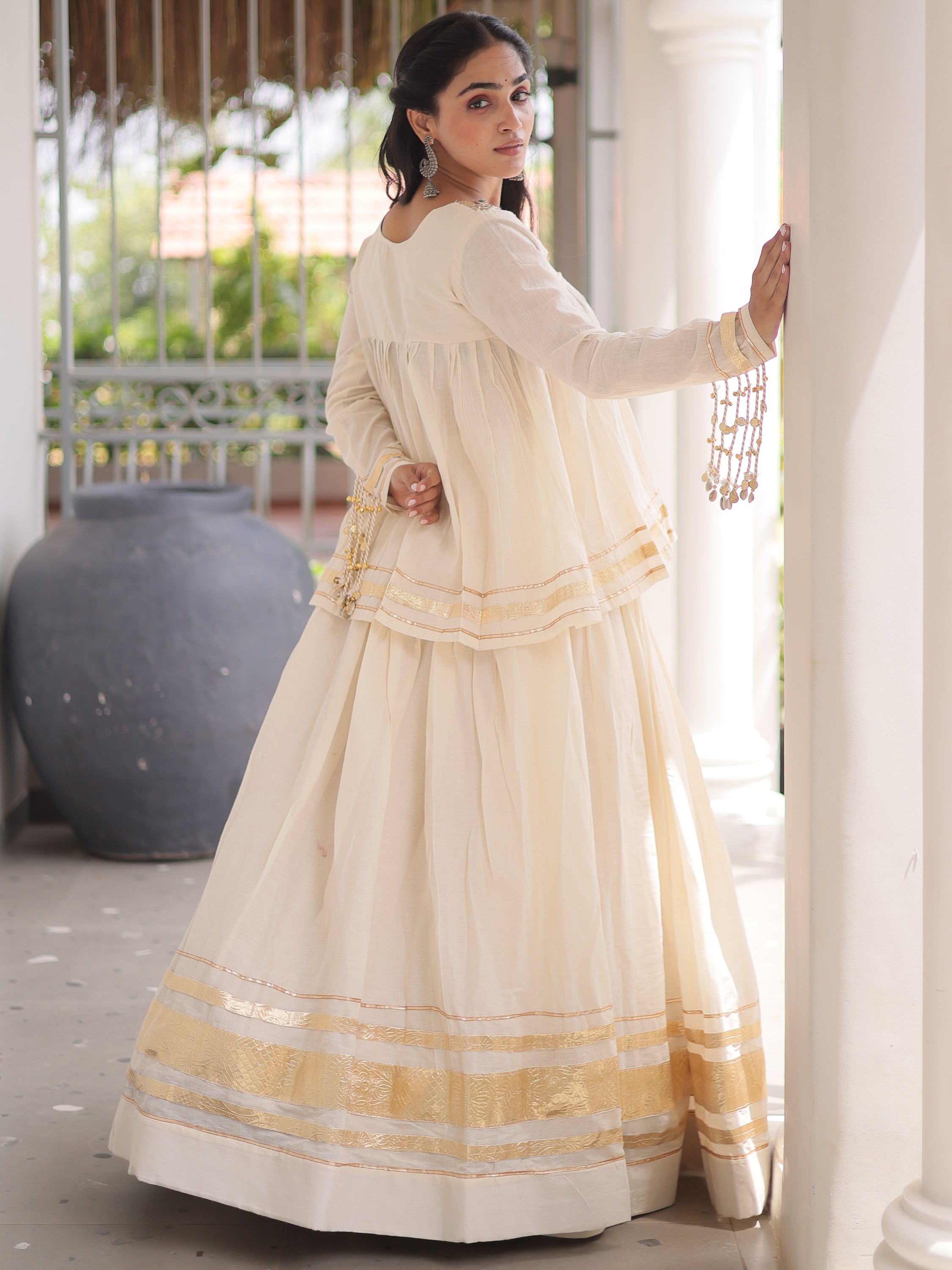 Alluring White Mirror Laced Navratri Wear Lehenga With Peplum Top