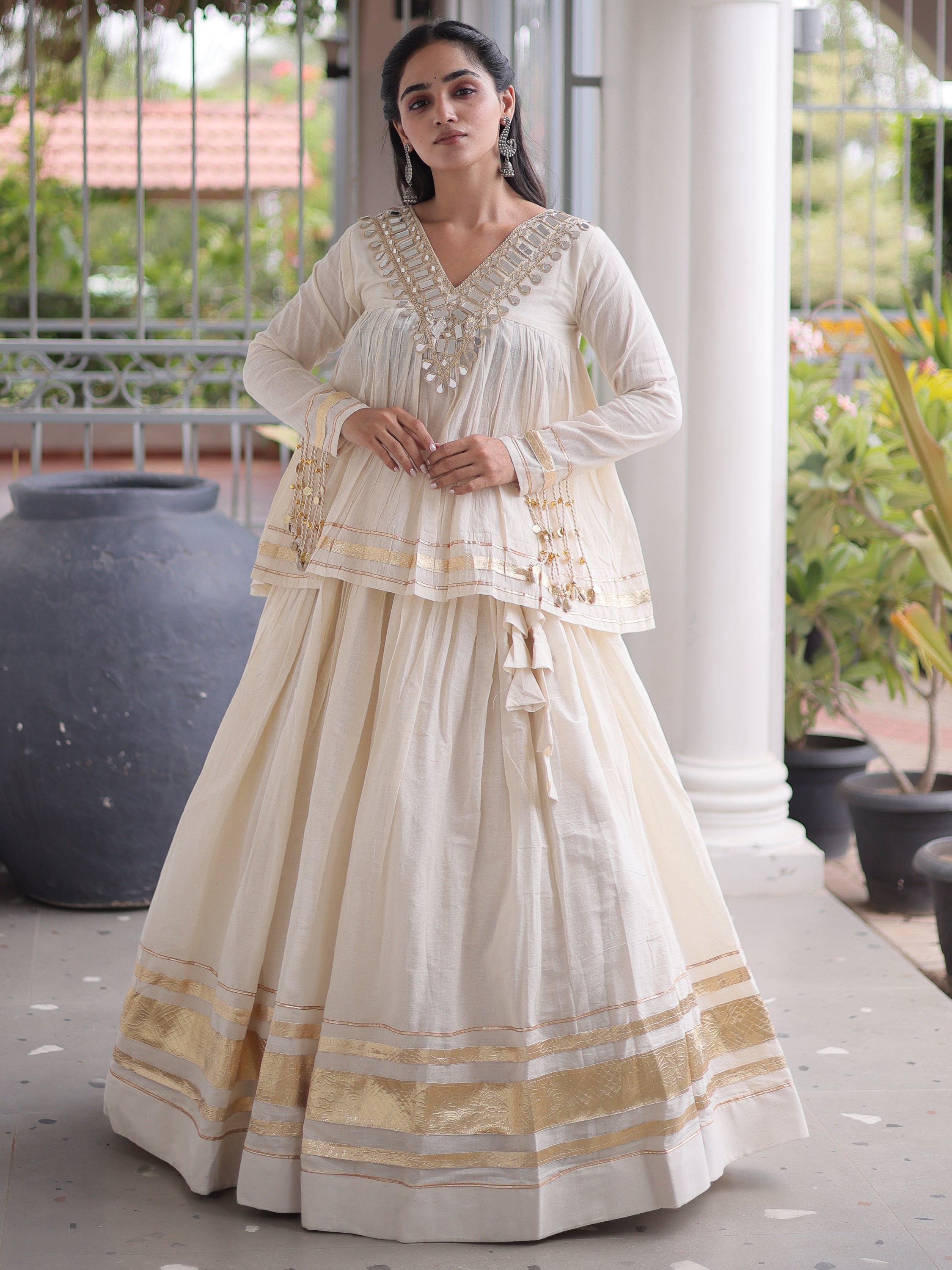 Alluring White Mirror Laced Navratri Wear Lehenga With Peplum Top