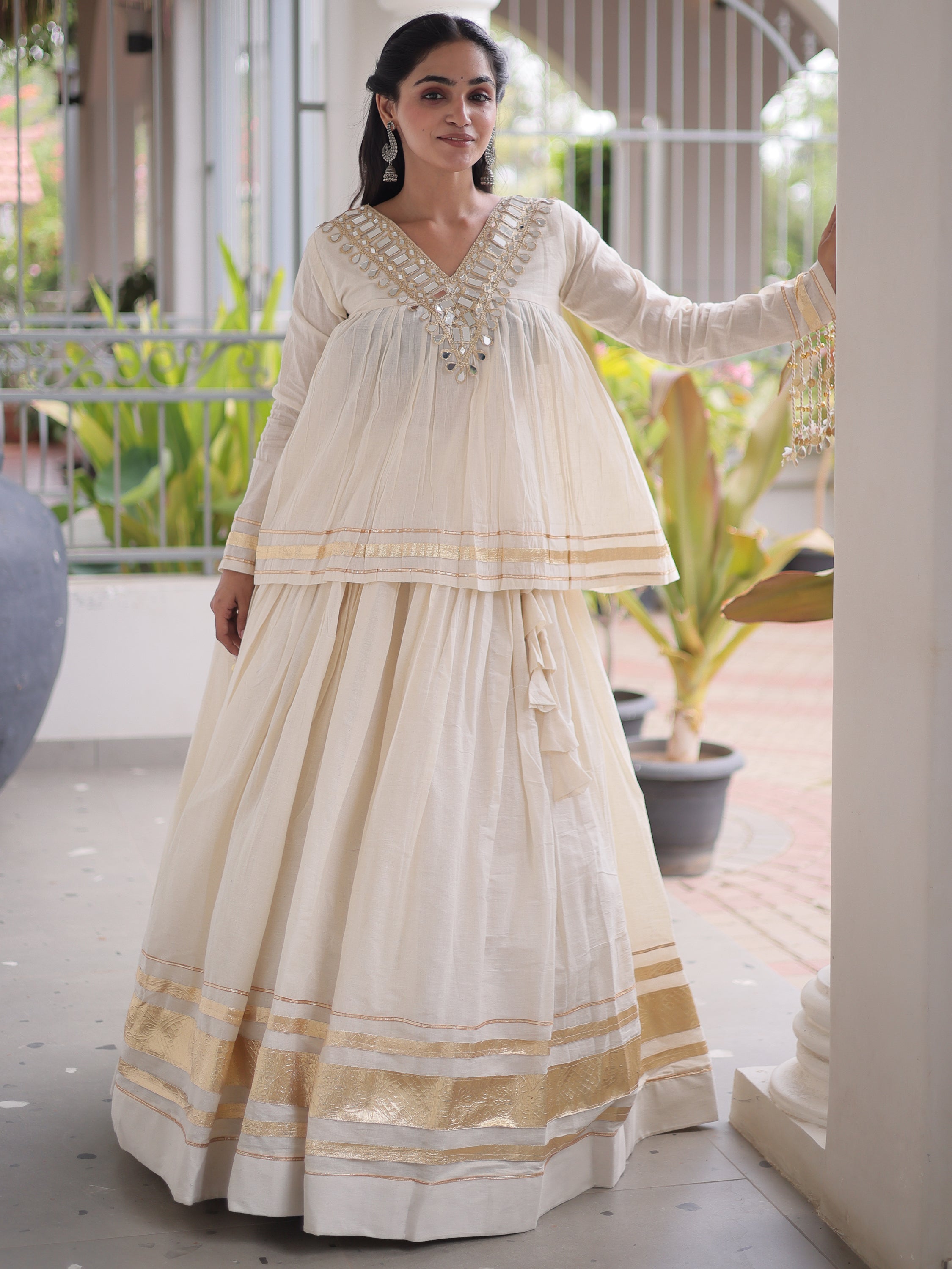 Alluring White Mirror Laced Navratri Wear Lehenga With Peplum Top