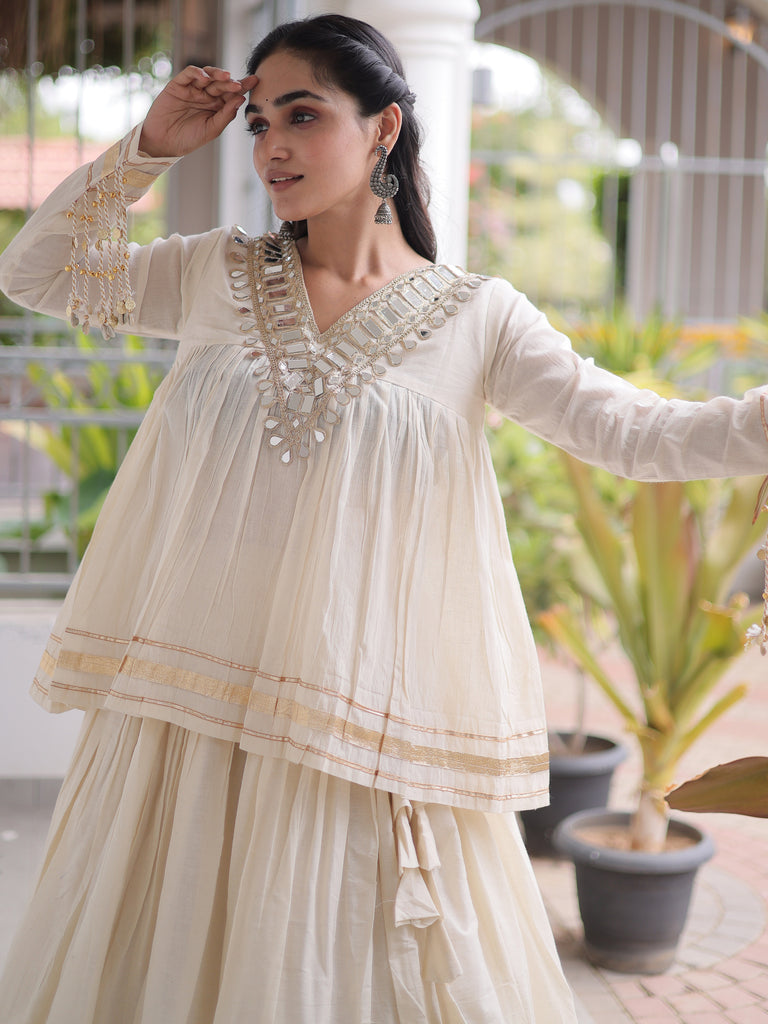 Alluring White Mirror Laced Navratri Wear Lehenga With Peplum Top