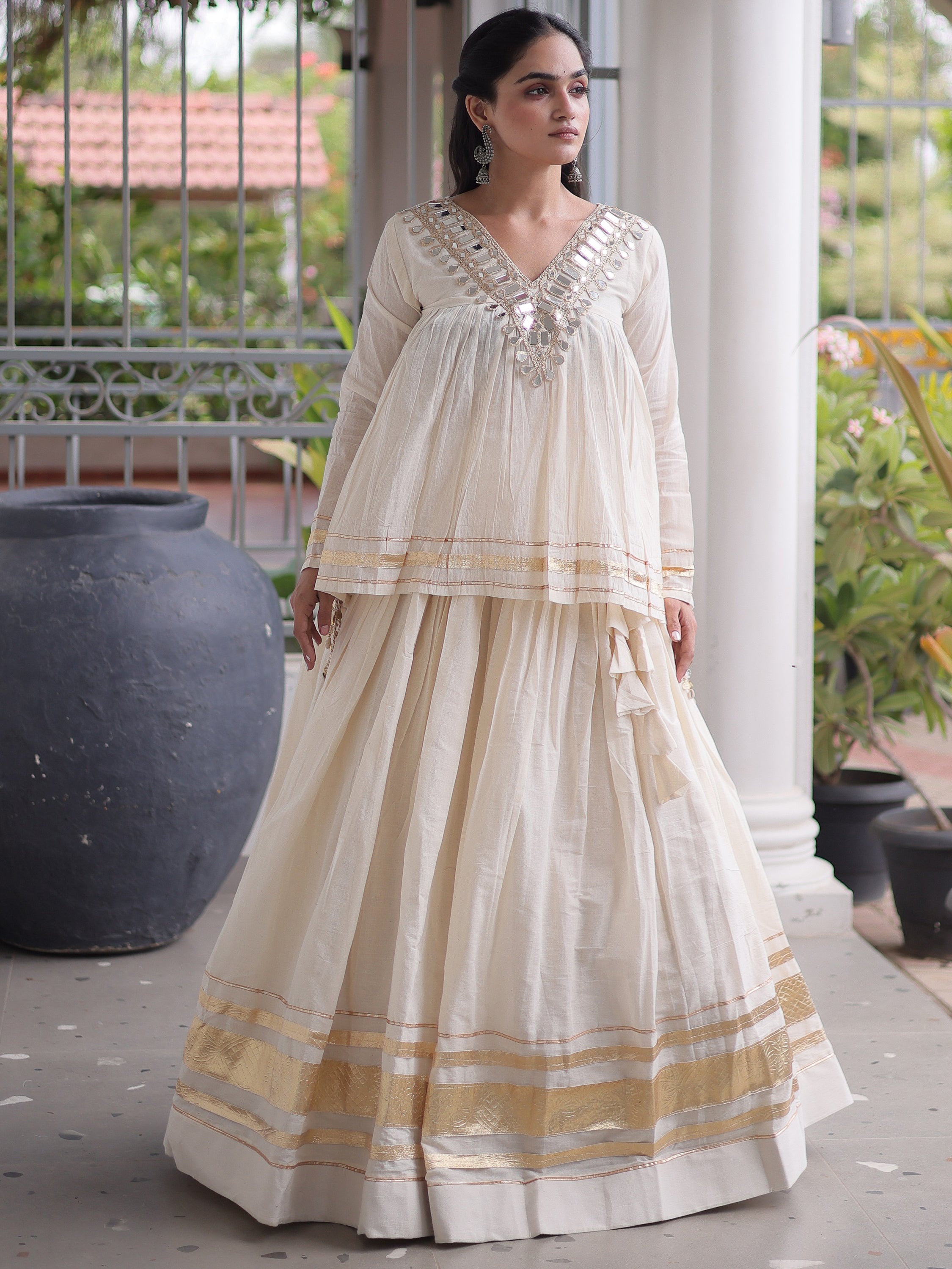 Alluring White Mirror Laced Navratri Wear Lehenga With Peplum Top