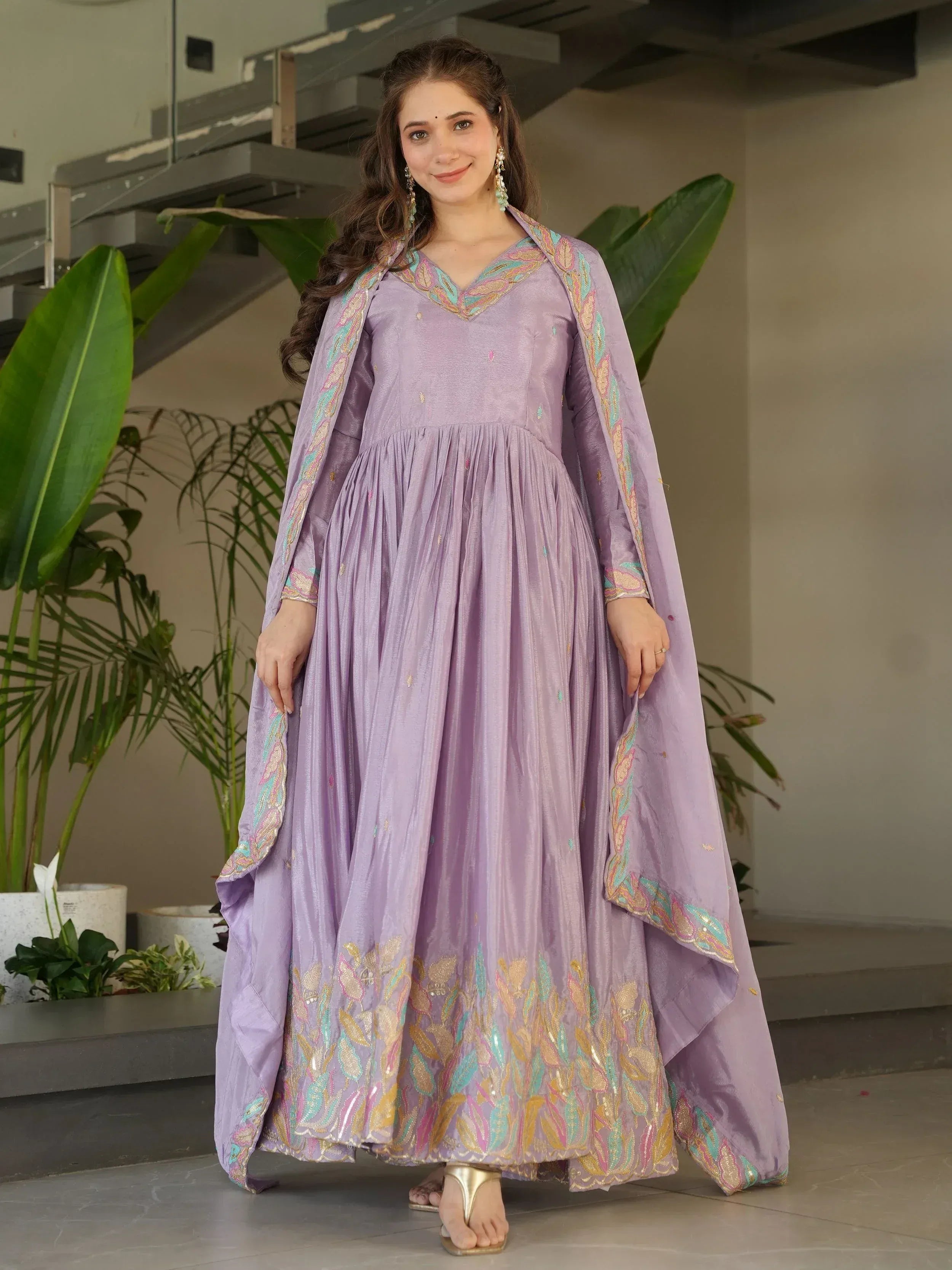 Lavender ethnic gown with floral embroidery and matching dupatta, perfect for Indian occasions