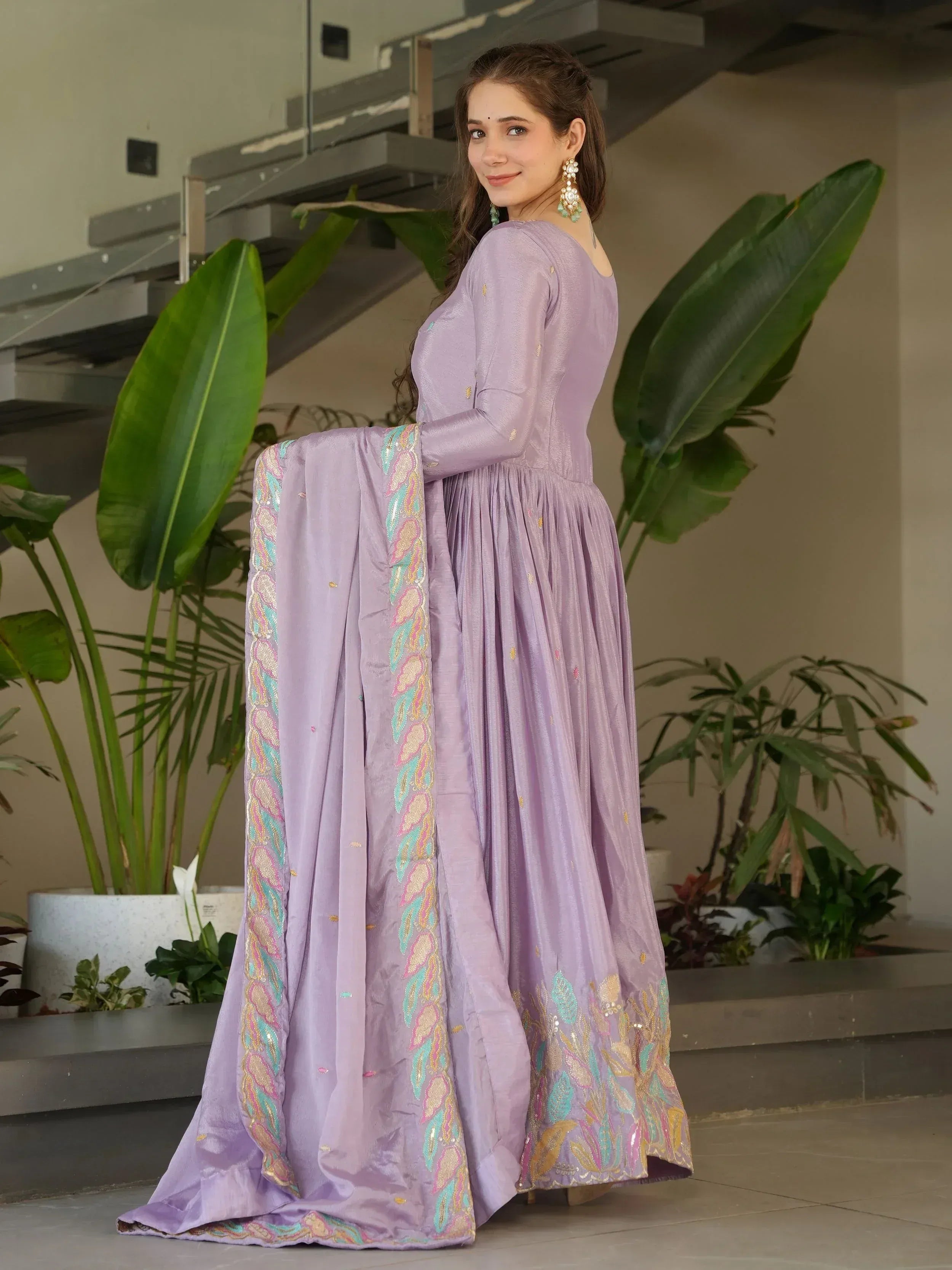 Lavender ethnic gown with floral embroidery and matching dupatta, perfect for Indian occasions