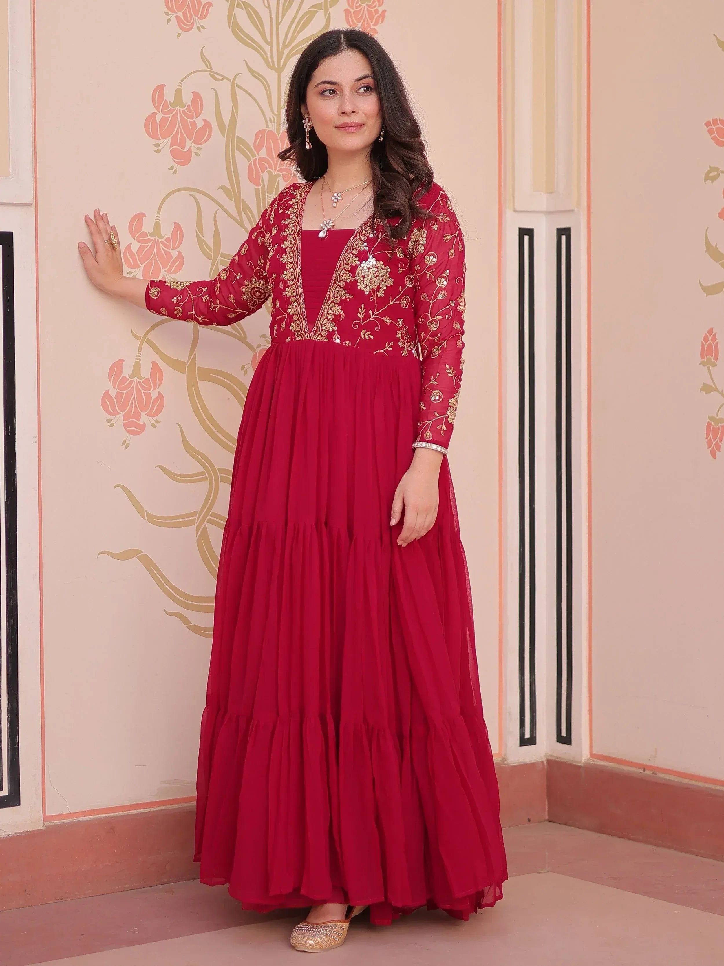 Red embroidered ethnic gown with gold detailing, perfect for Indian occasions and festive wear.