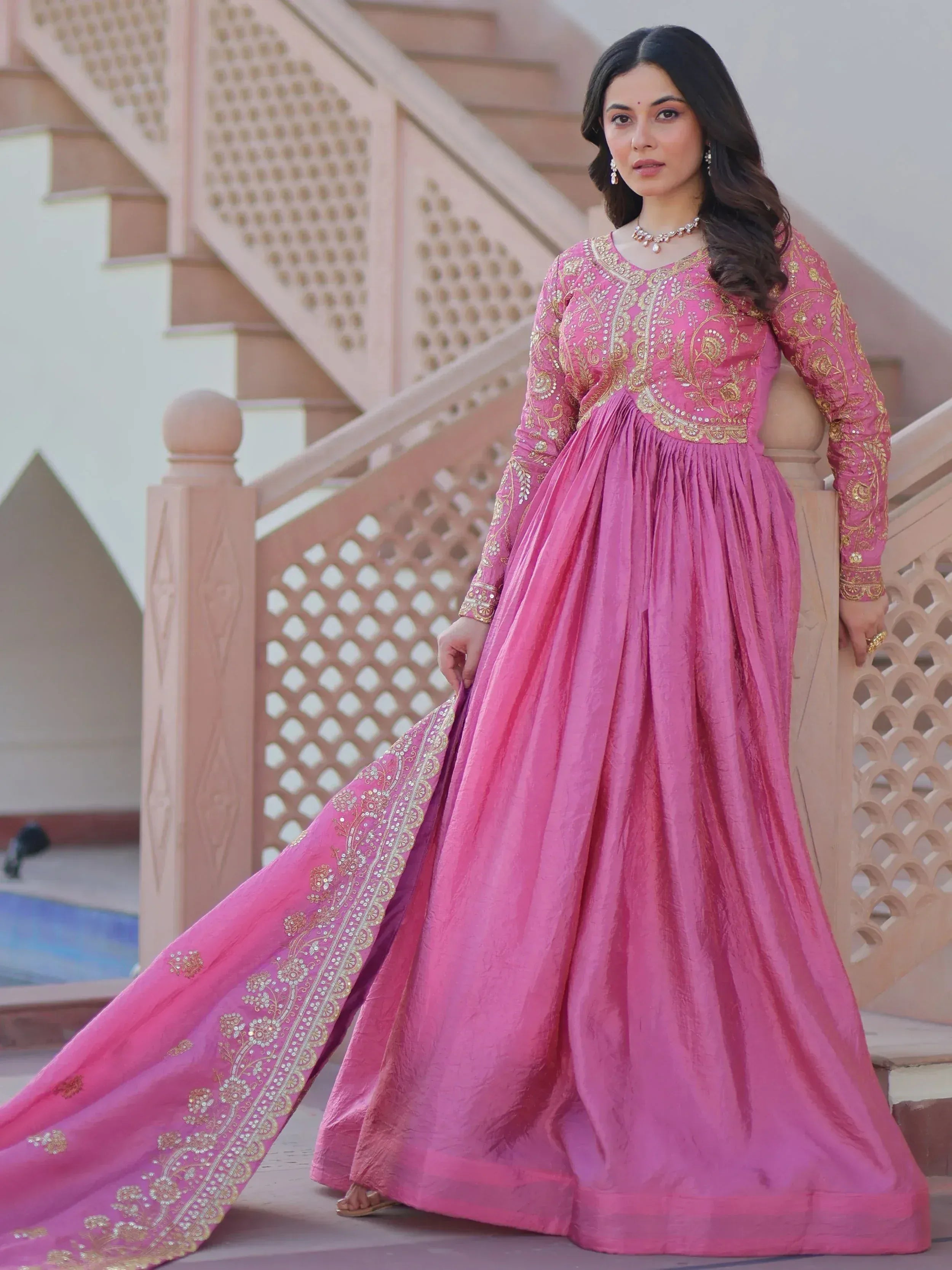 Pink ethnic gown with gold embroidery, perfect for Indian occasions and festive wear.