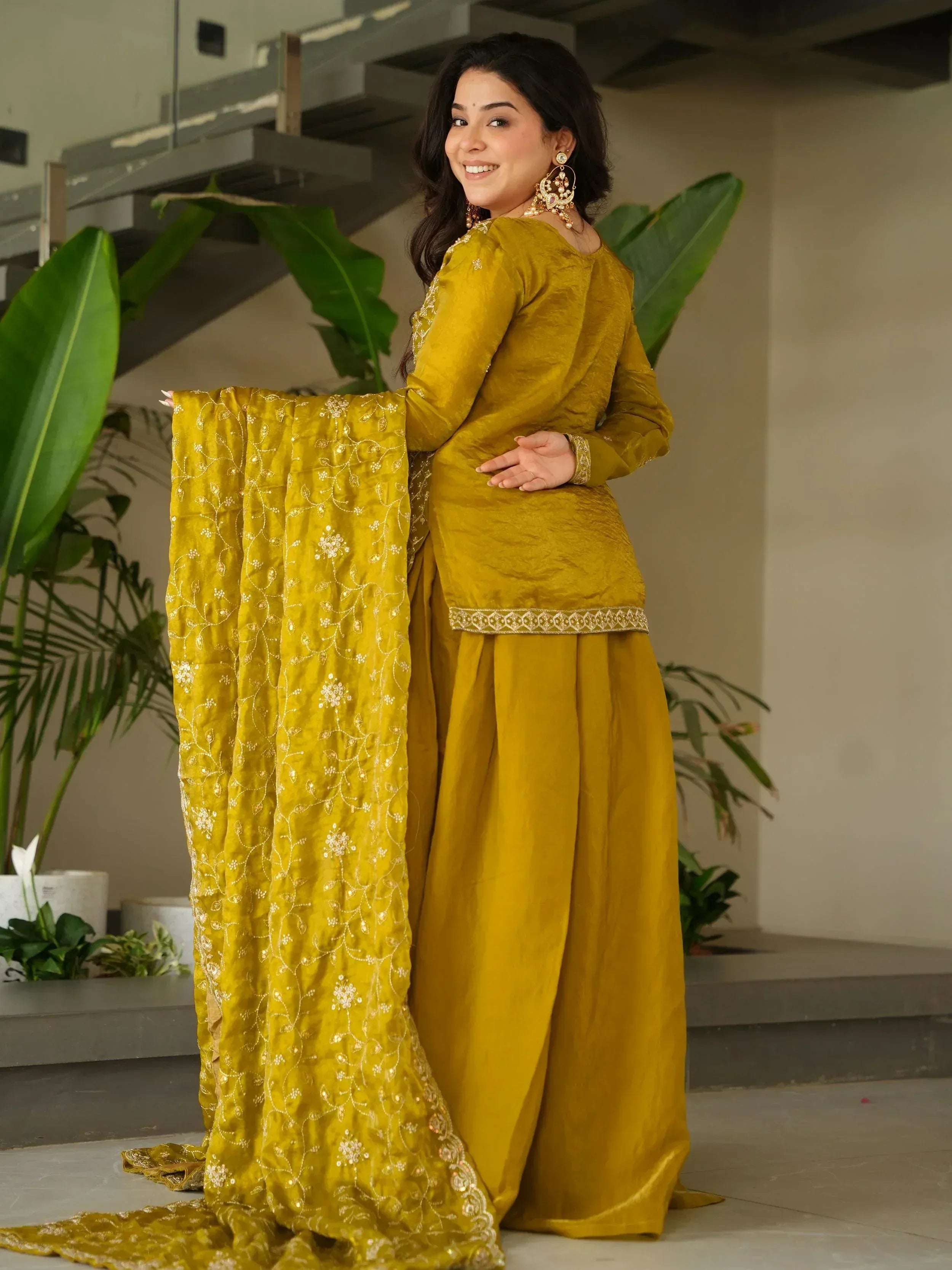 Mustard yellow ethnic salwar kameez with floral embroidery and dupatta, perfect for Indian occasions