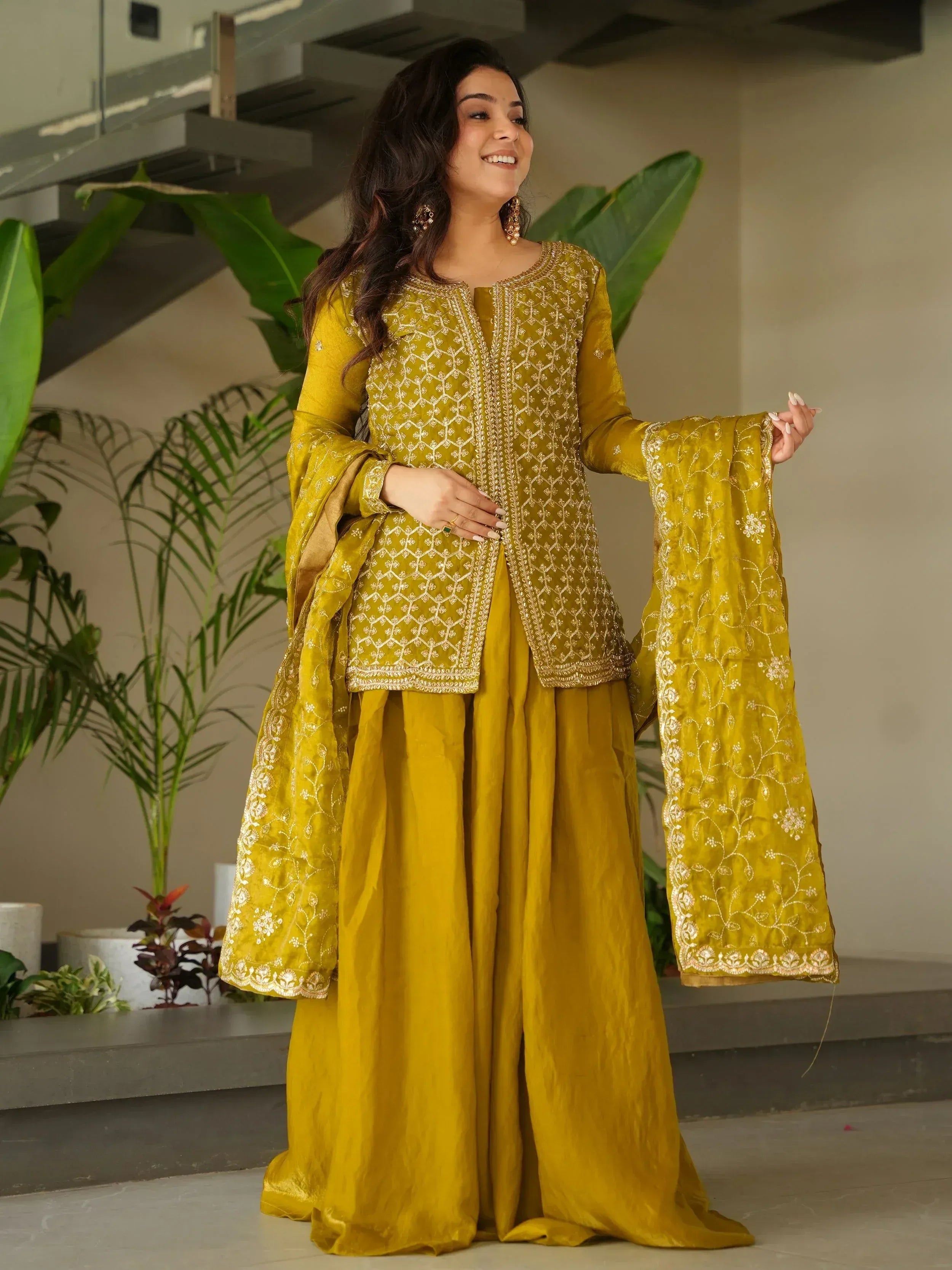 Elegant mustard yellow ethnic suit with intricate white embroidery and flared pants