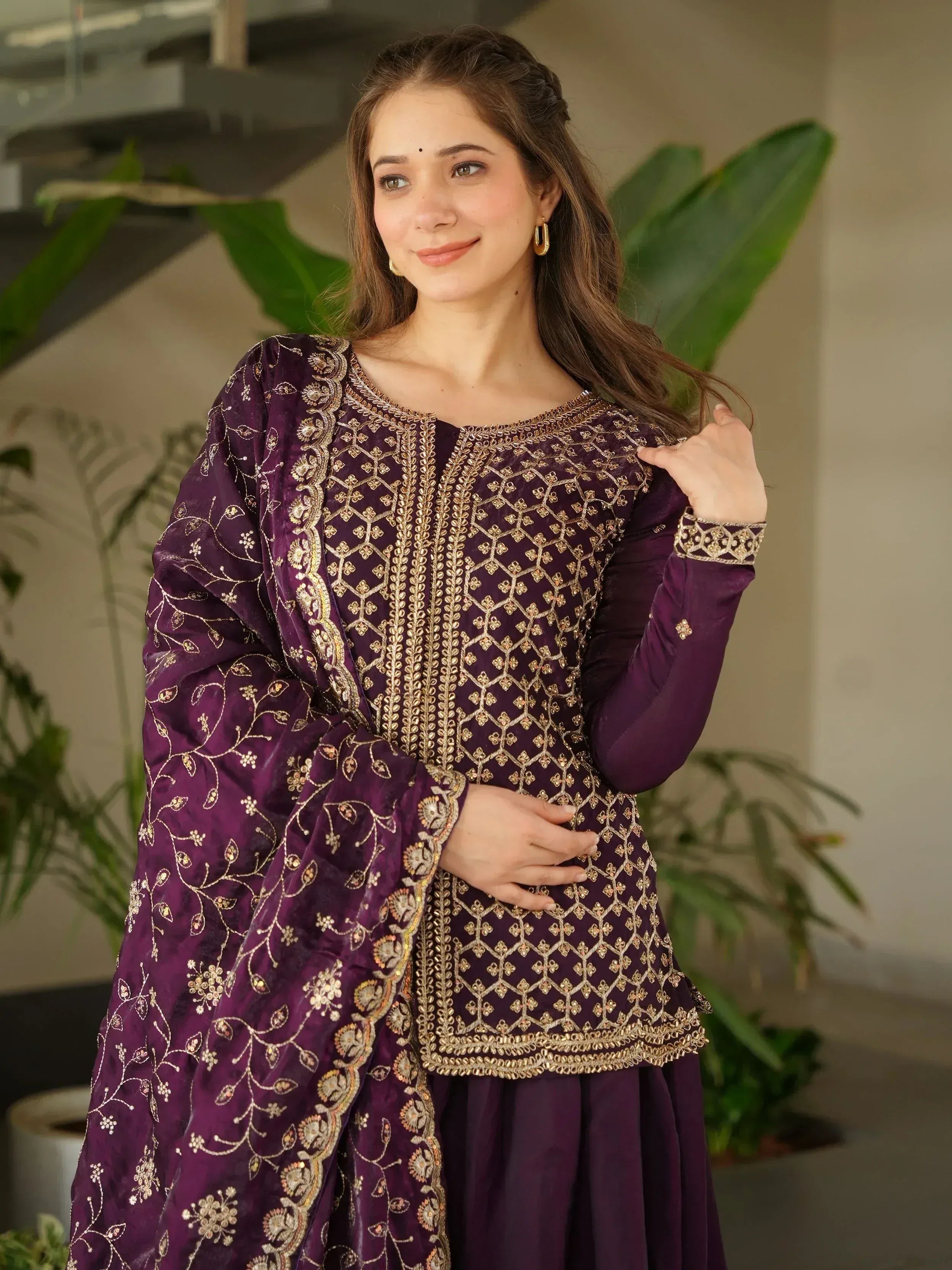 Purple embroidered ethnic salwar kameez with gold detailing, perfect for Indian festive occasions