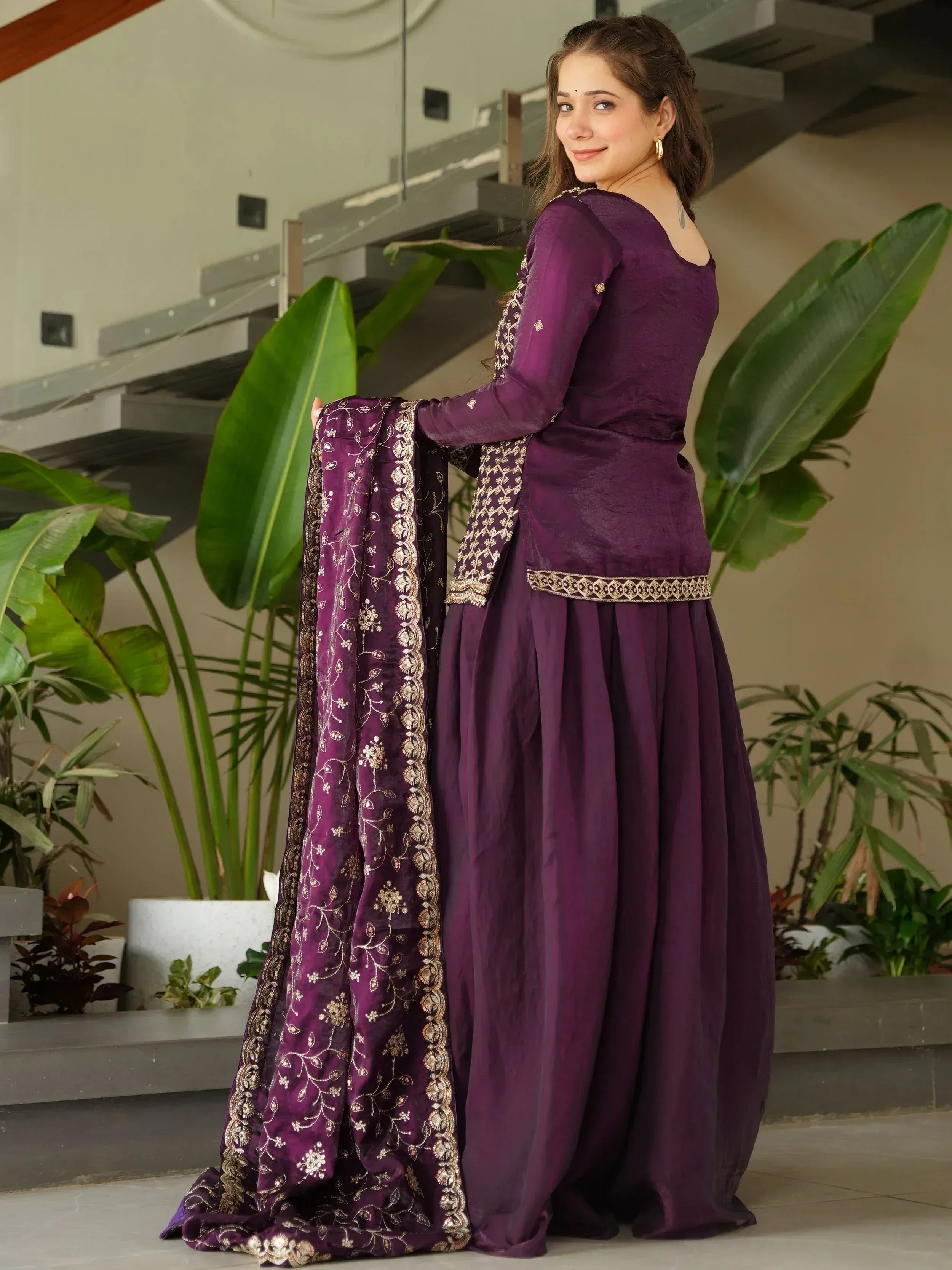 Purple embroidered salwar kameez with gold detailing, perfect for Indian ethnic wear occasions
