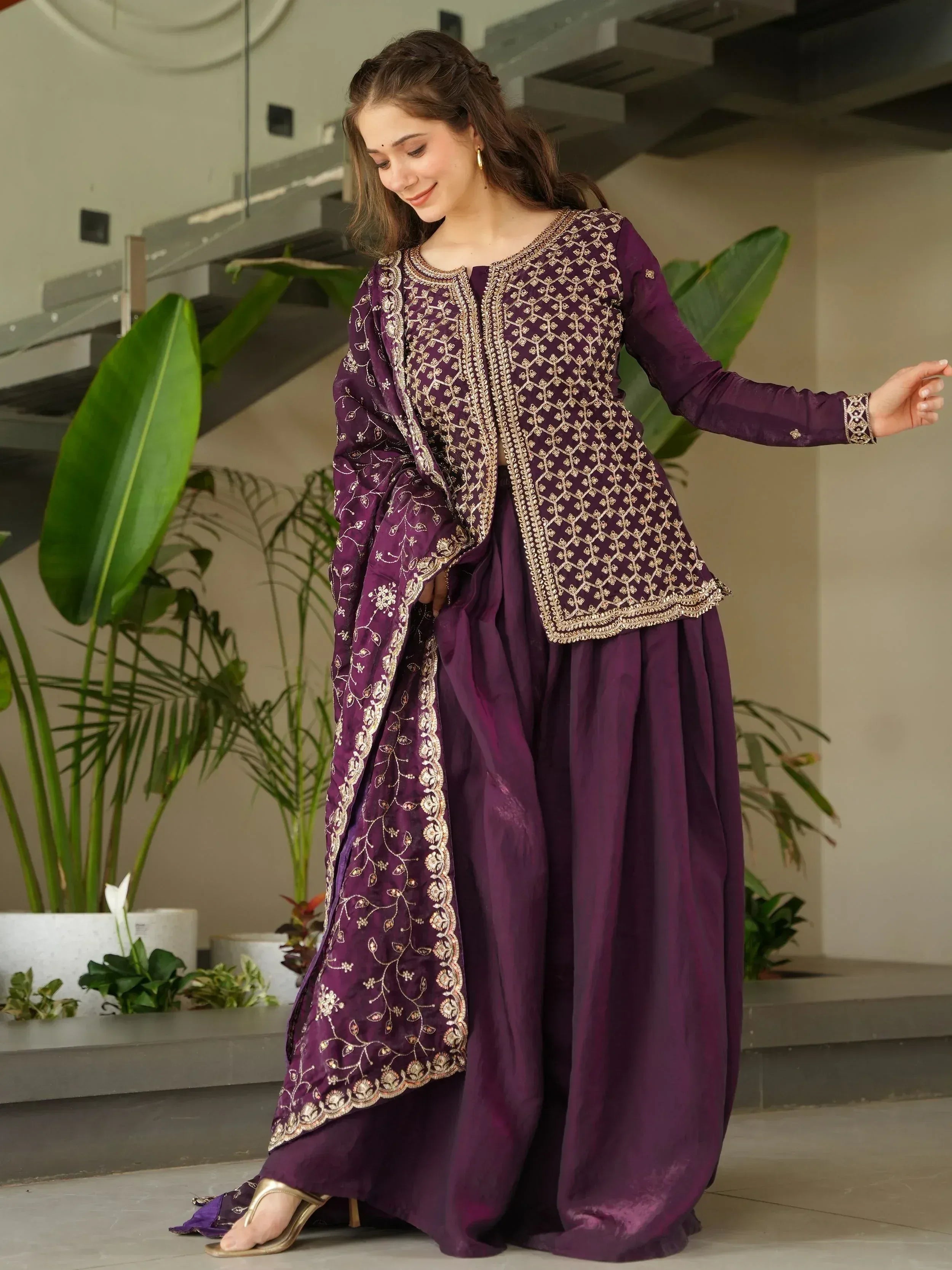 Purple embroidered salwar kameez with gold detailing, perfect for Indian ethnic wear occasions