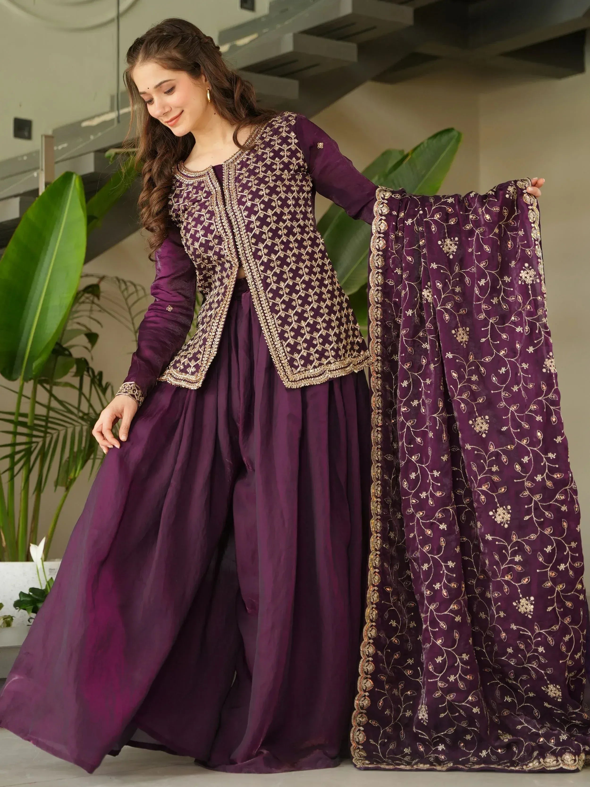 Purple embroidered Indian ethnic sharara suit with gold detailing, perfect for weddings and festive occasions