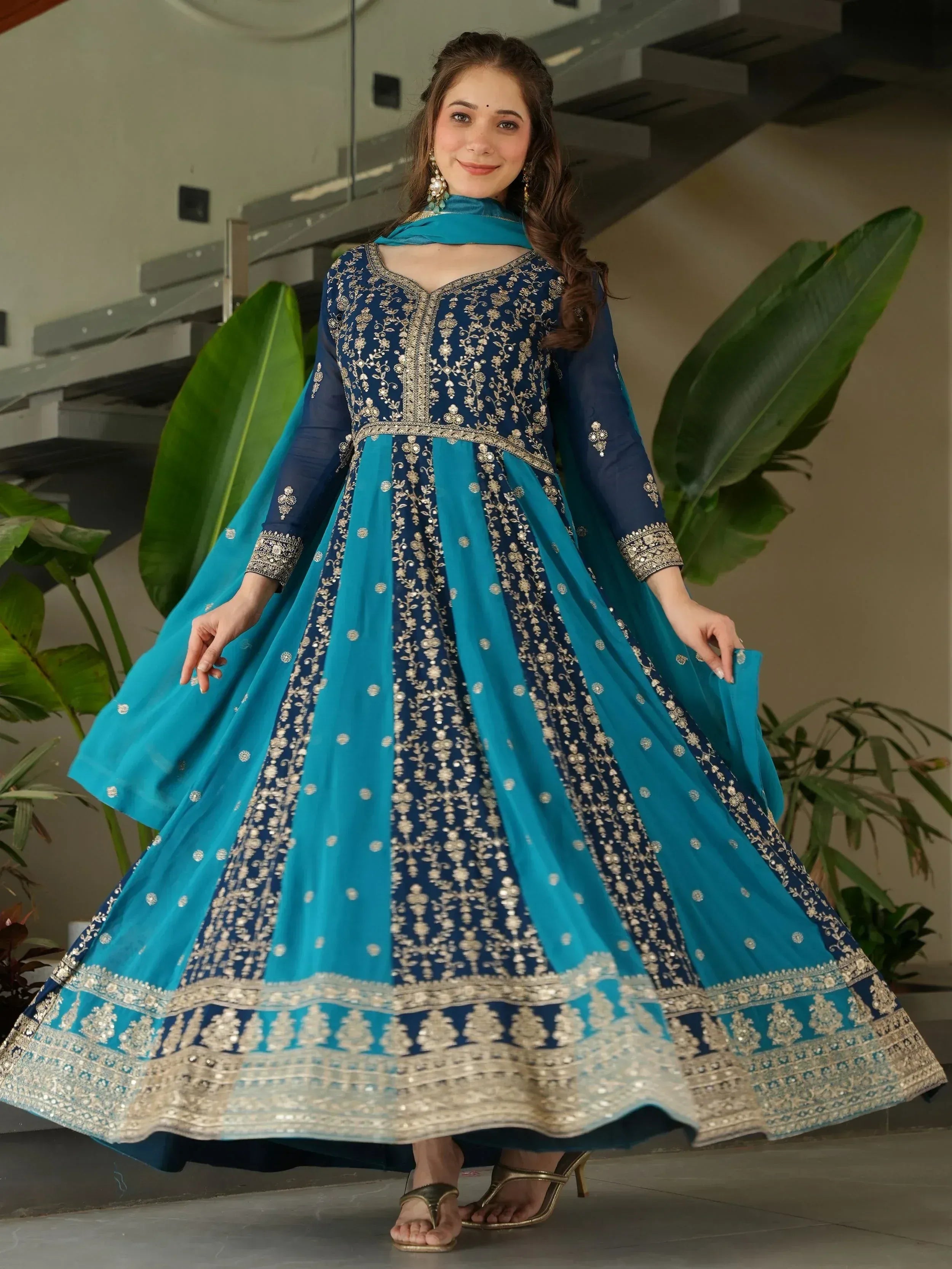 Blue and teal embroidered anarkali suit with gold detailing, perfect for Indian ethnic wear occasions.