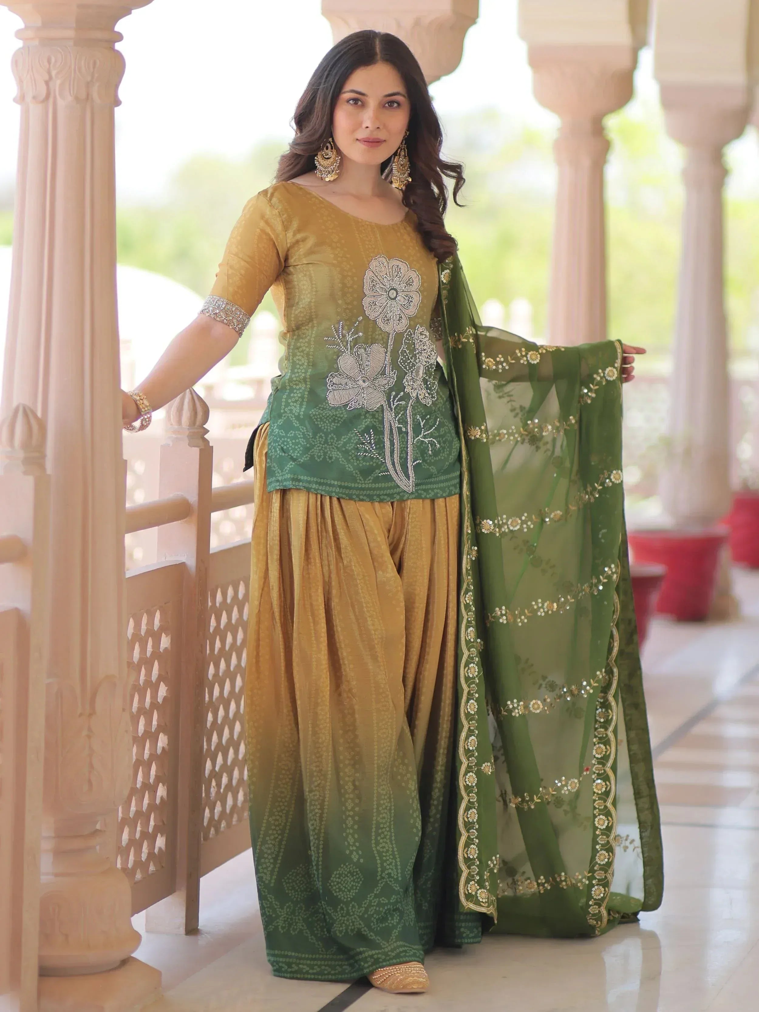 Elegant green and gold ethnic salwar kameez with floral embroidery and sheer dupatta