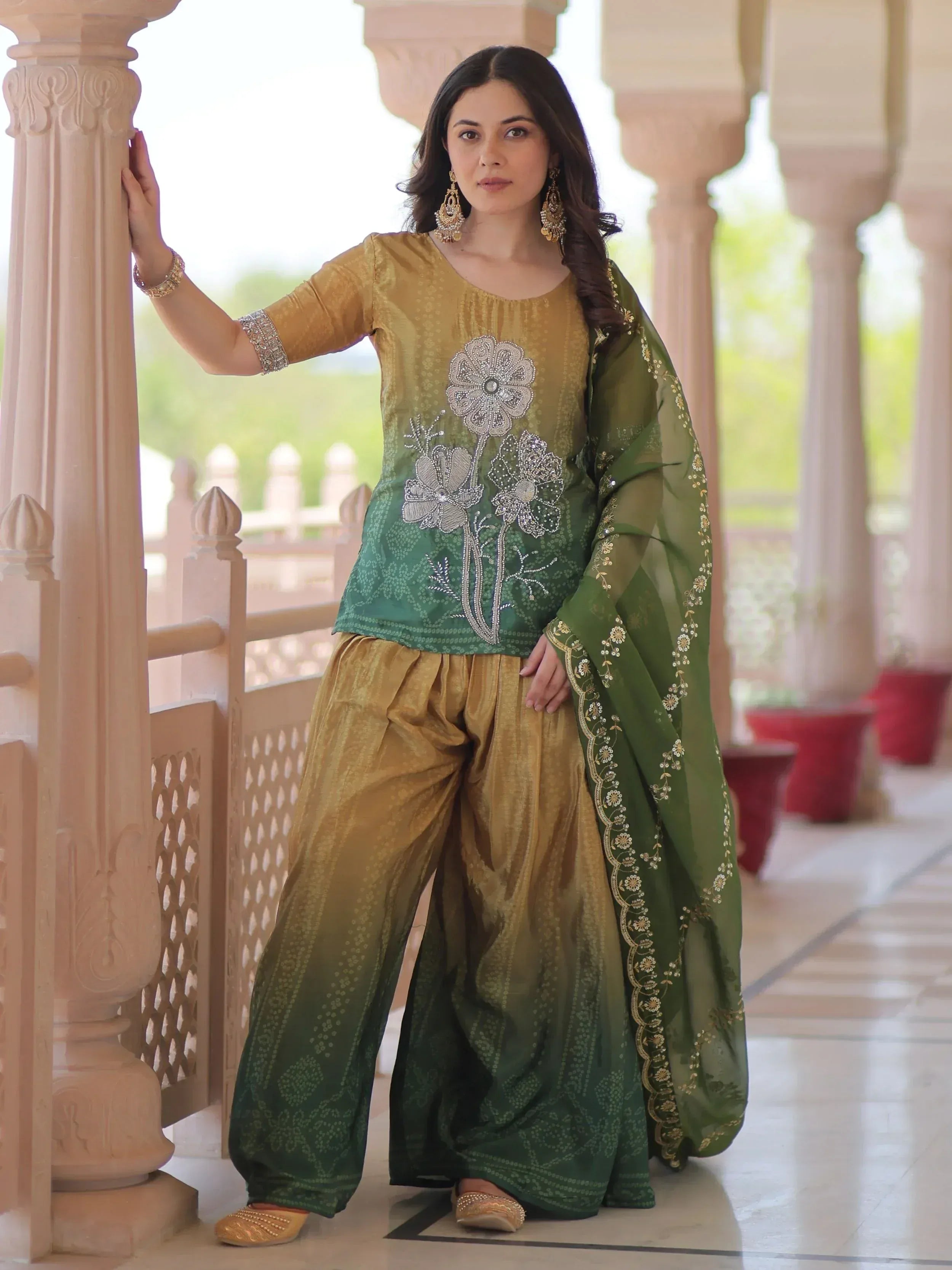 Green and gold embroidered salwar kameez with floral design, perfect for Indian ethnic wear