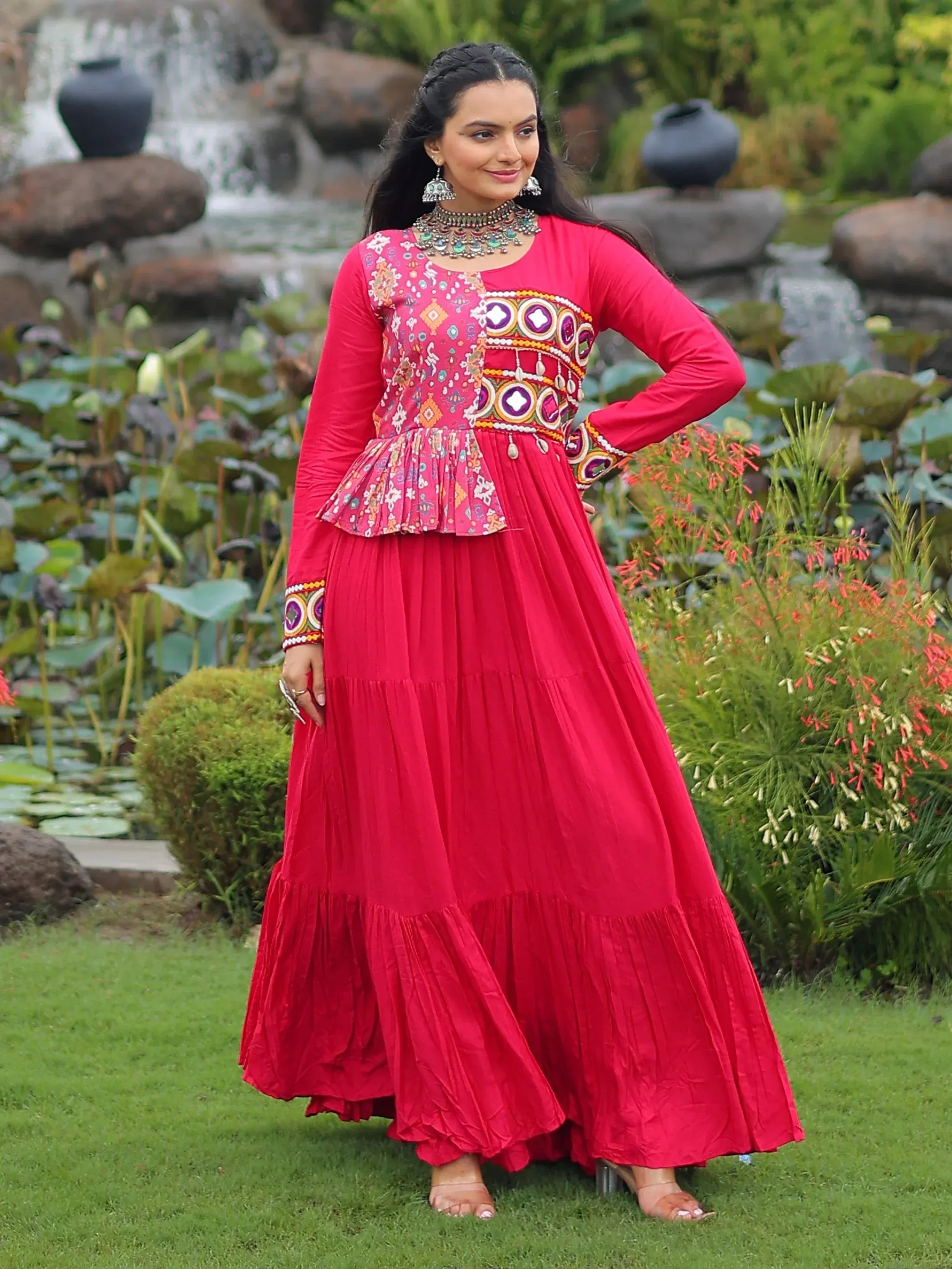 Vibrant red ethnic gown with intricate embroidery, perfect for Indian festive occasions and weddings.