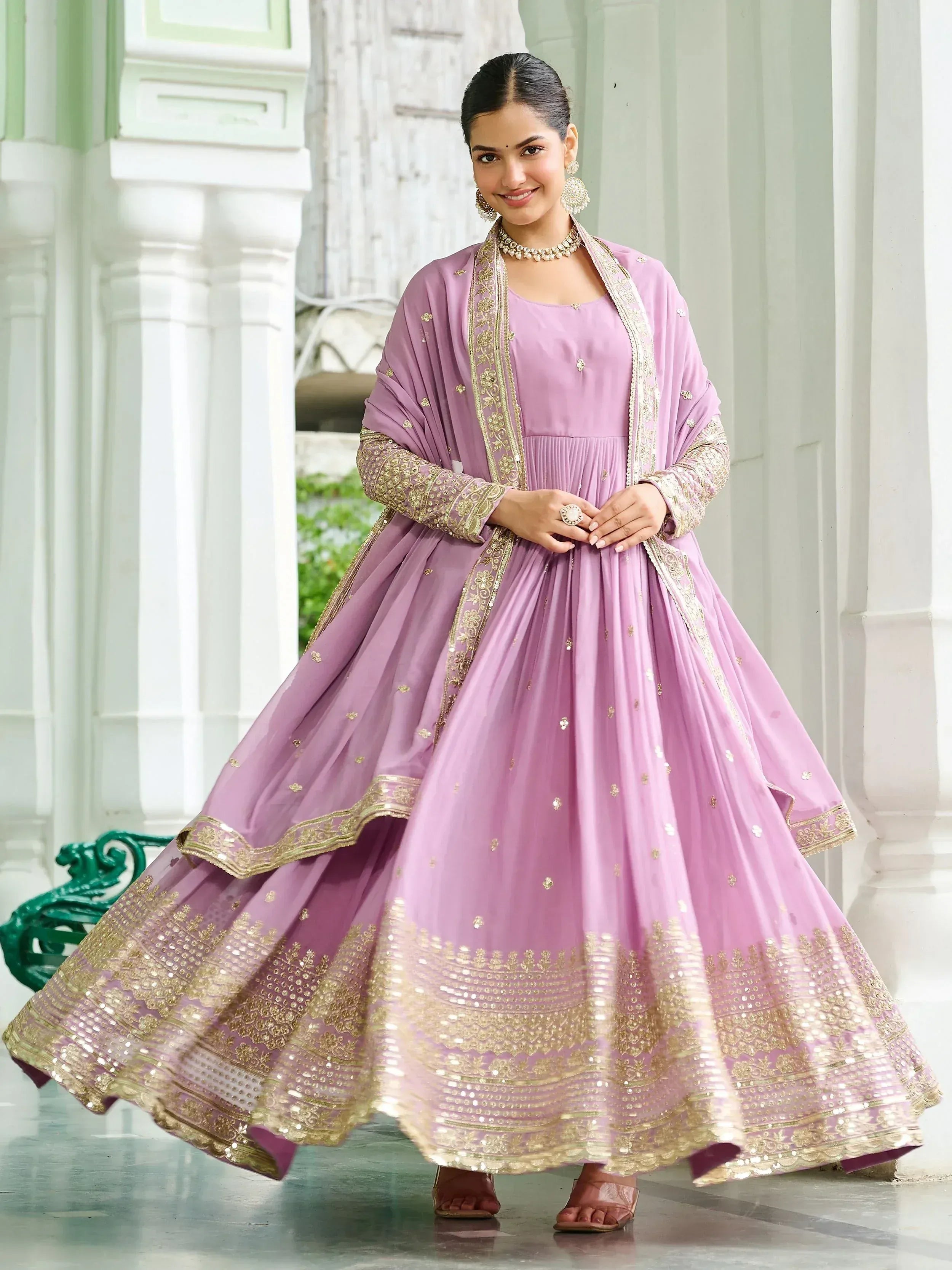 Lavender ethnic anarkali gown with gold embroidery, perfect for Indian weddings and festive occasions.