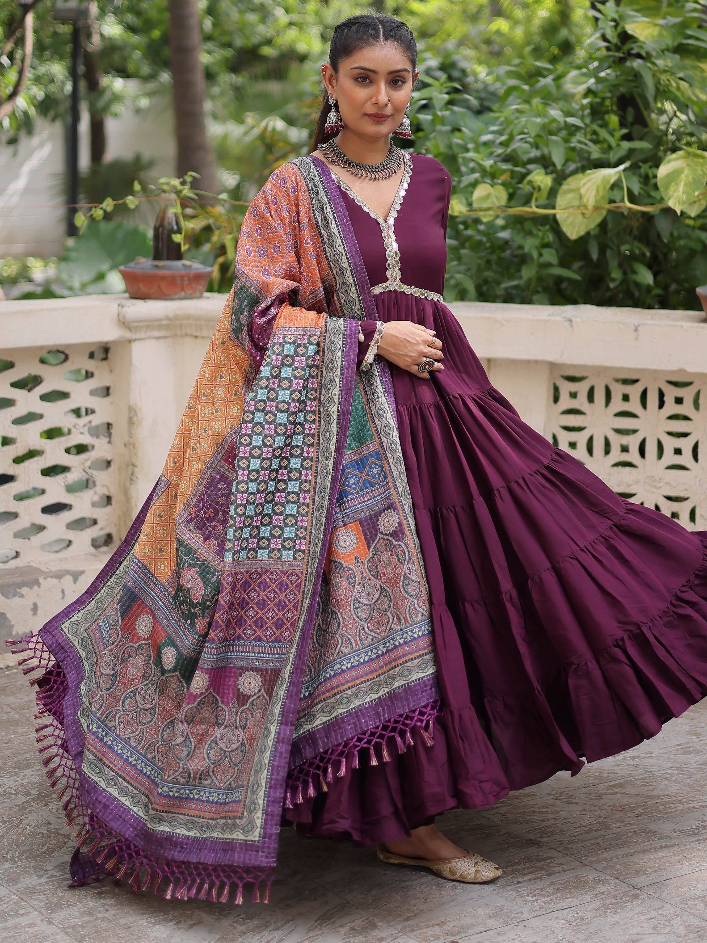 Elegant purple ethnic gown with colorful patchwork dupatta, perfect for Indian celebrations