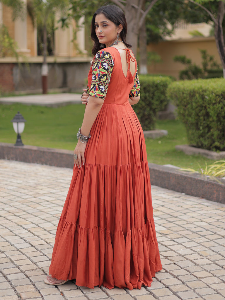 Astonishing Rust Orange Kutchi Work Rayon Navratri Wear Gown