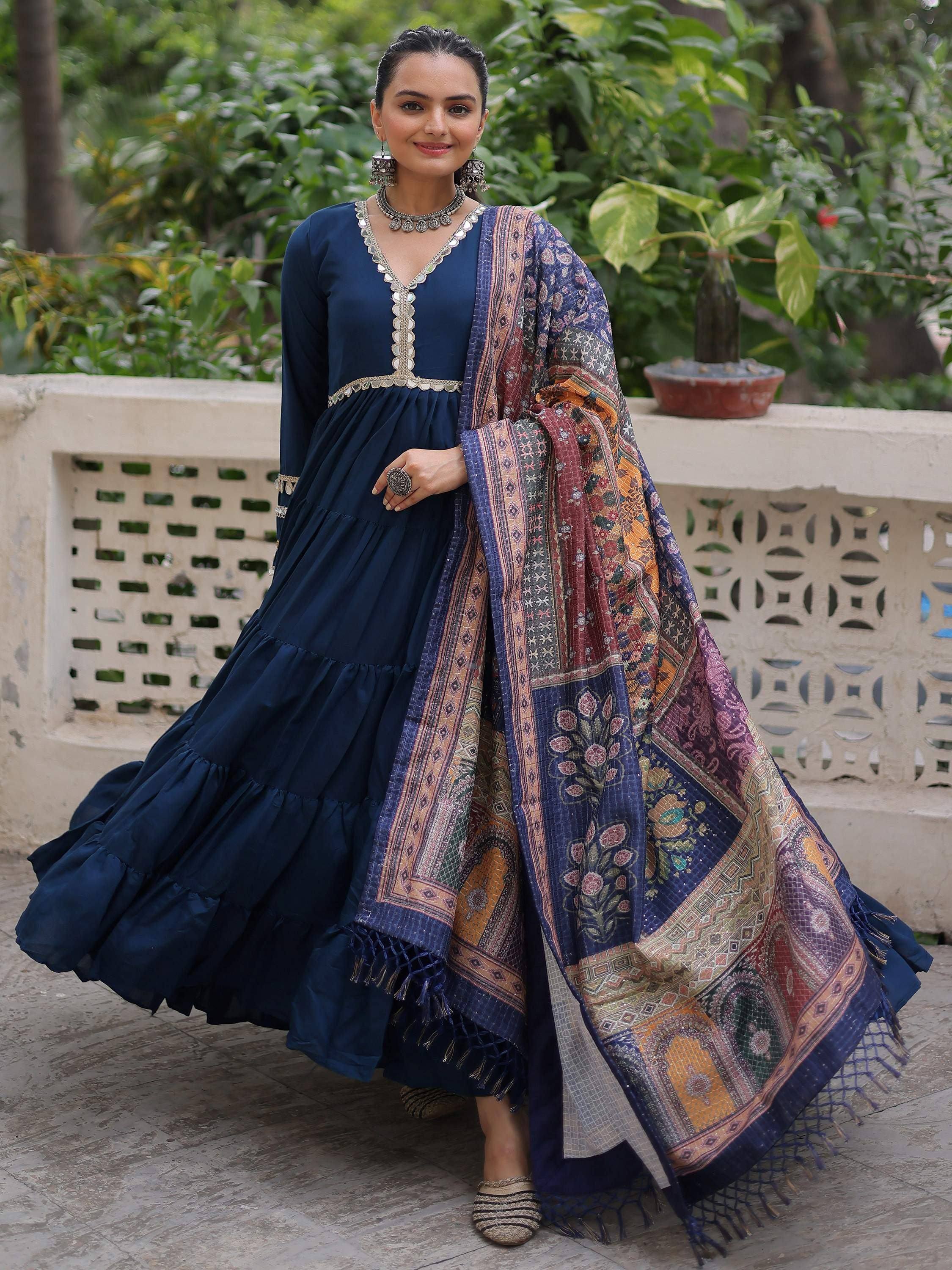 Elegant navy blue tiered anarkali with embroidered neckline and colorful printed dupatta, perfect for ethnic occasions.