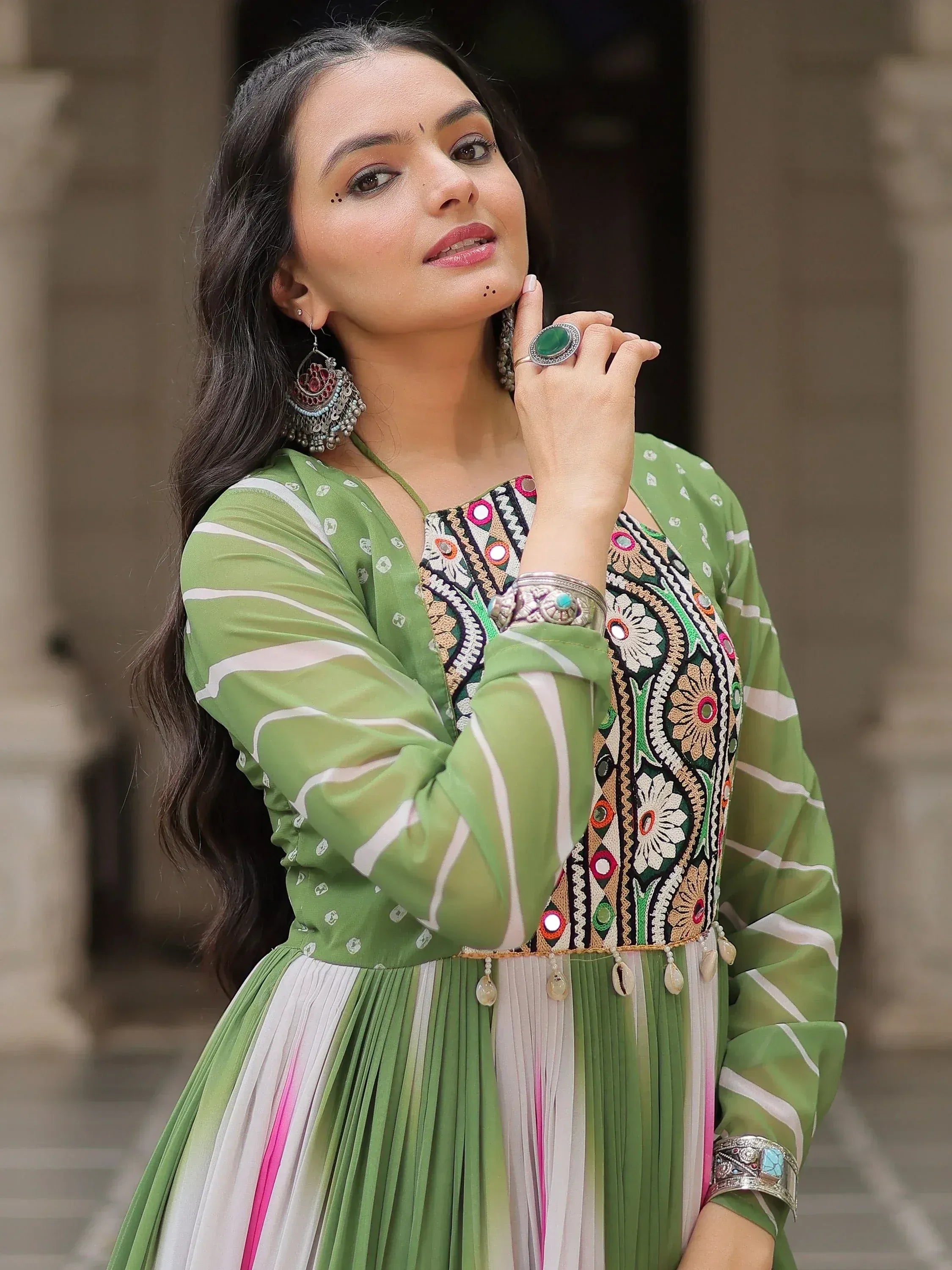 Green embroidered ethnic gown with mirror work, perfect for Indian festive wear and designer occasions.