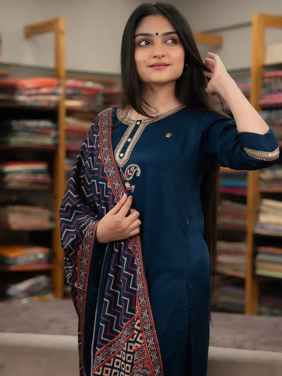 Woman in navy blue embroidered kurta with patterned dupatta, ethnic Indian wear