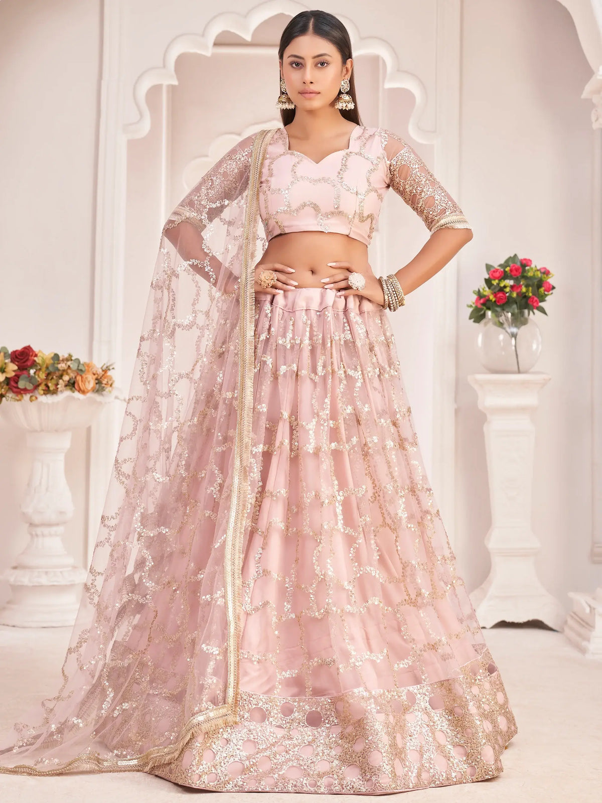 Prominent Pastel Pink Sequins Embroidery Net Lehenga Choli