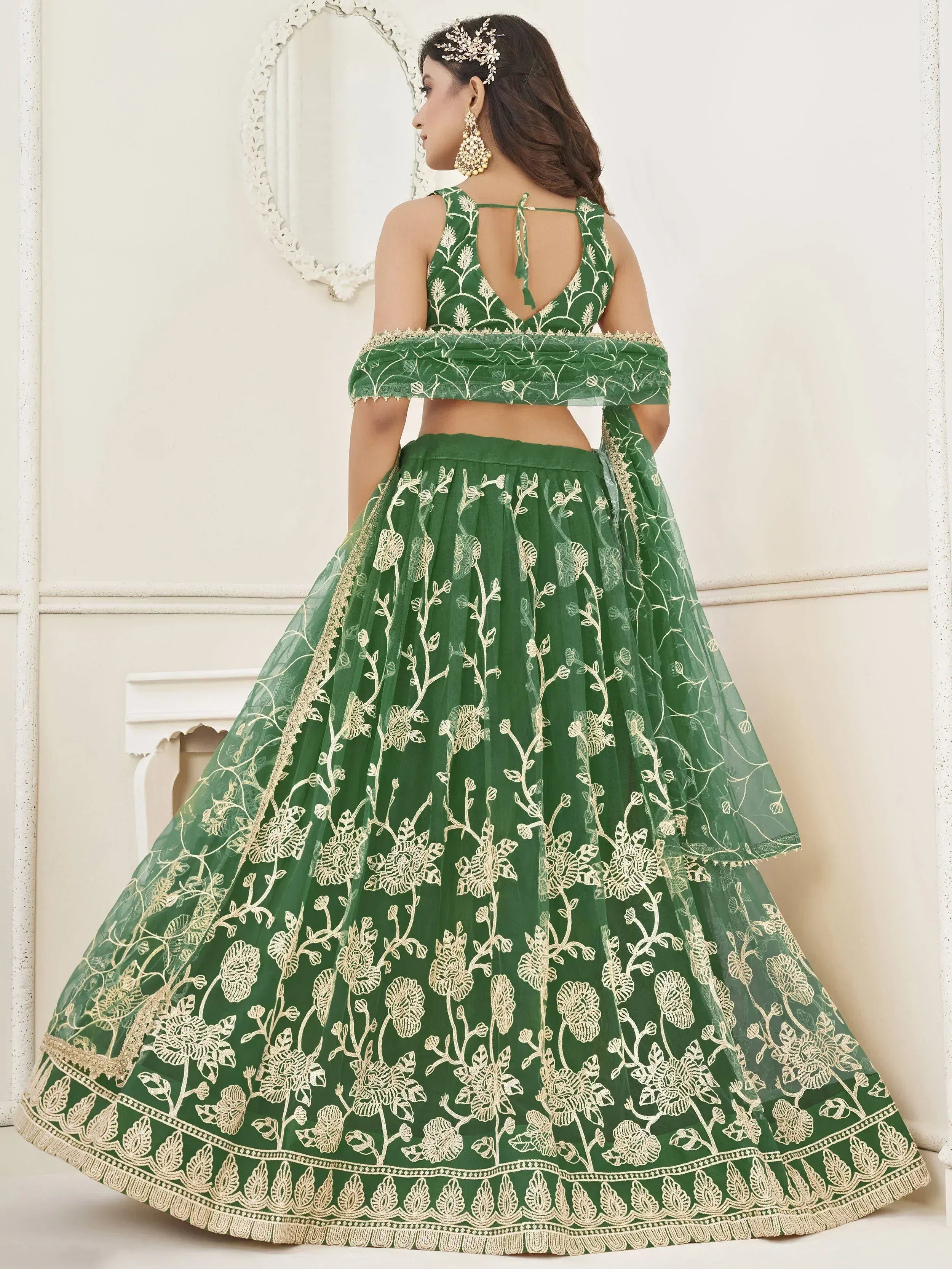 Green embroidered lehenga choli with floral design, perfect for Indian ethnic wear occasions