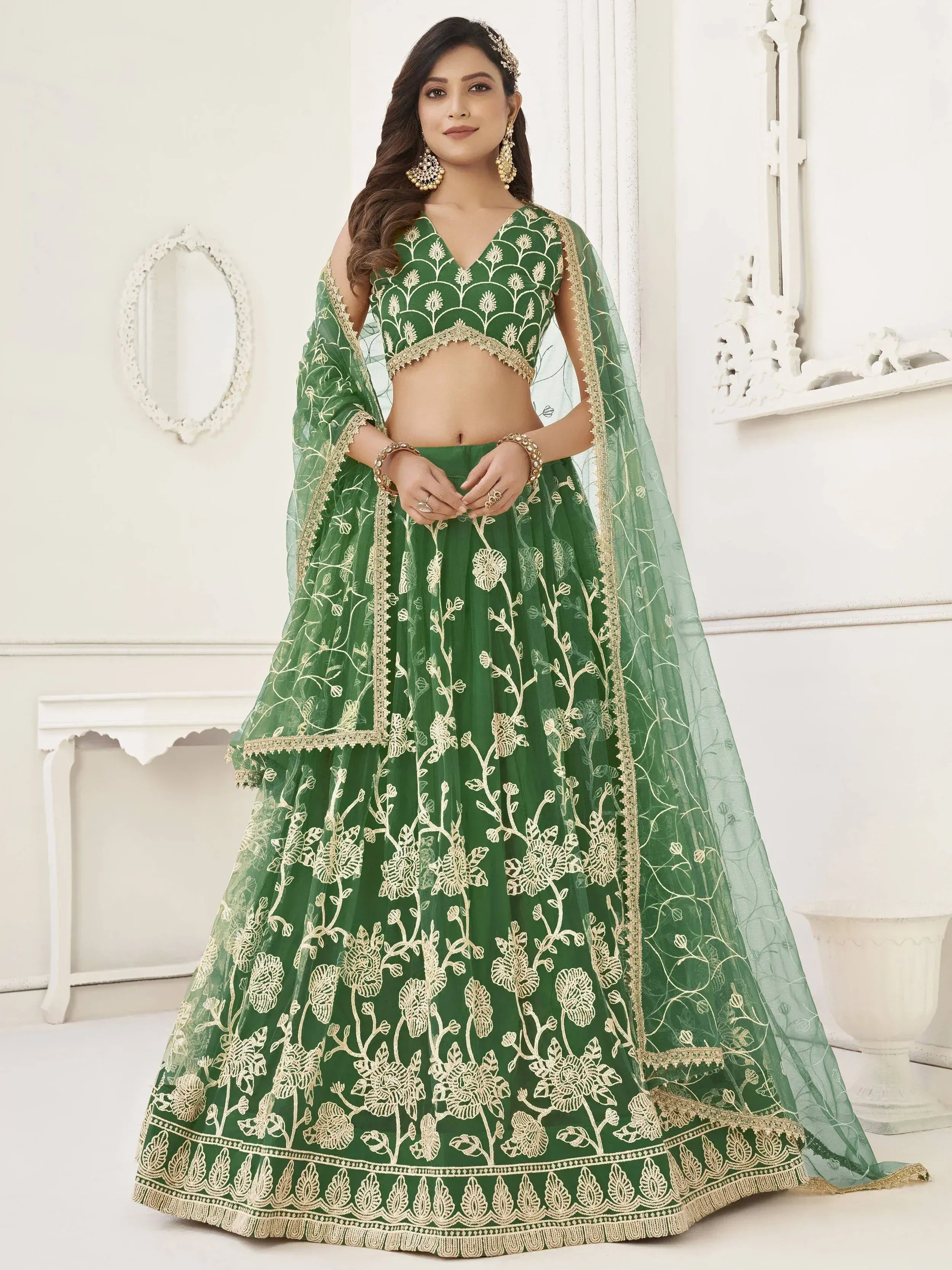 Green floral embroidered lehenga choli with gold detailing, perfect for Indian weddings and festivals.