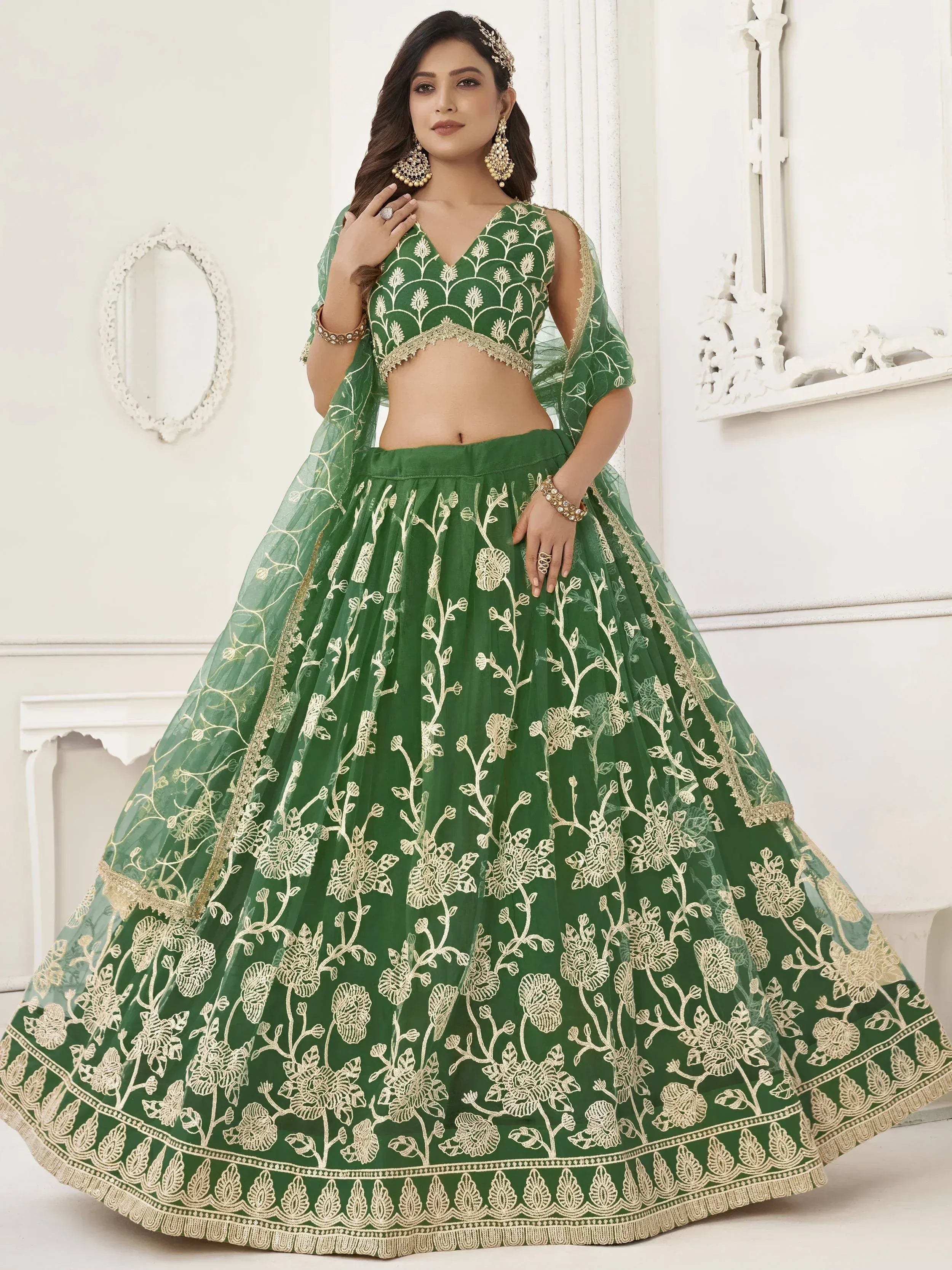 Emerald green lehenga choli with gold floral embroidery, perfect for Indian weddings and festive occasions.