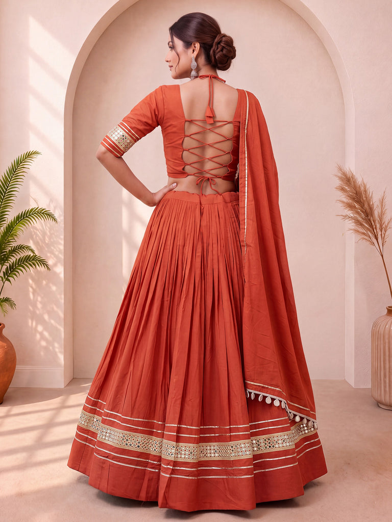 Stylish Rust Orange Mirror Laced Cotton Navratri Special Lehenga Choli