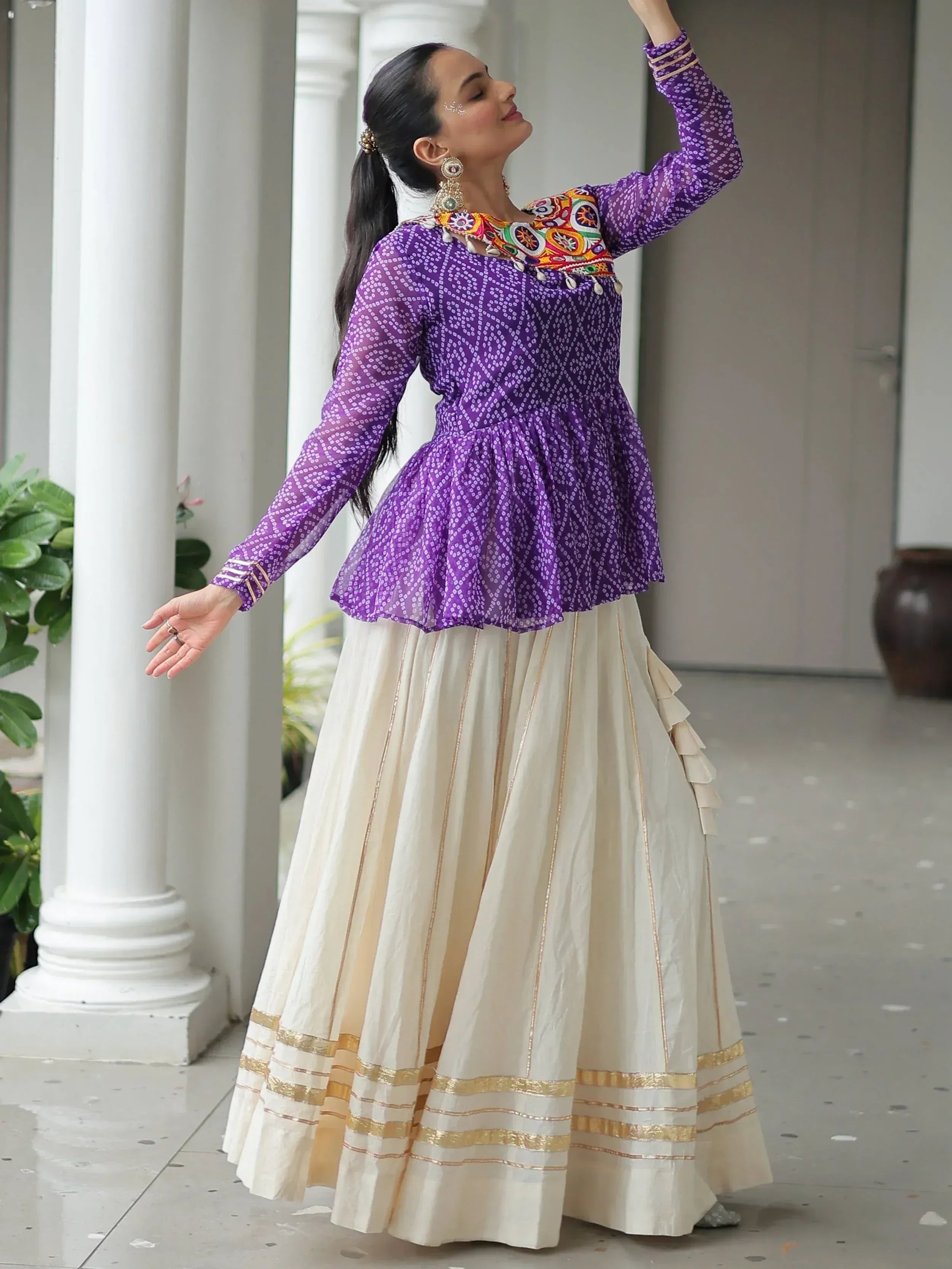 Purple printed peplum top with colorful embroidery paired with cream pleated skirt, Indian ethnic wear