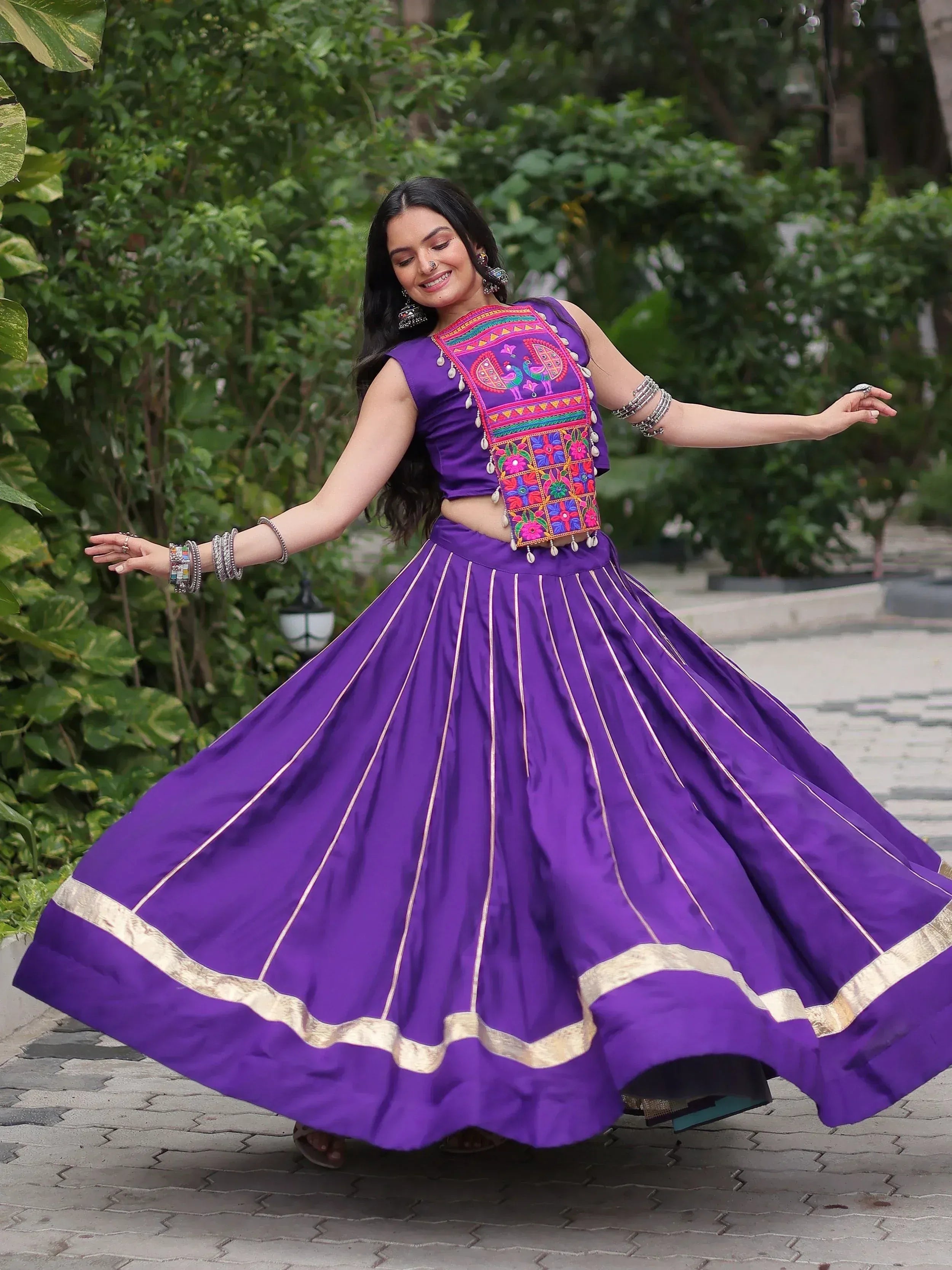 Purple embroidered lehenga choli with gold trim, perfect for Indian ethnic wear