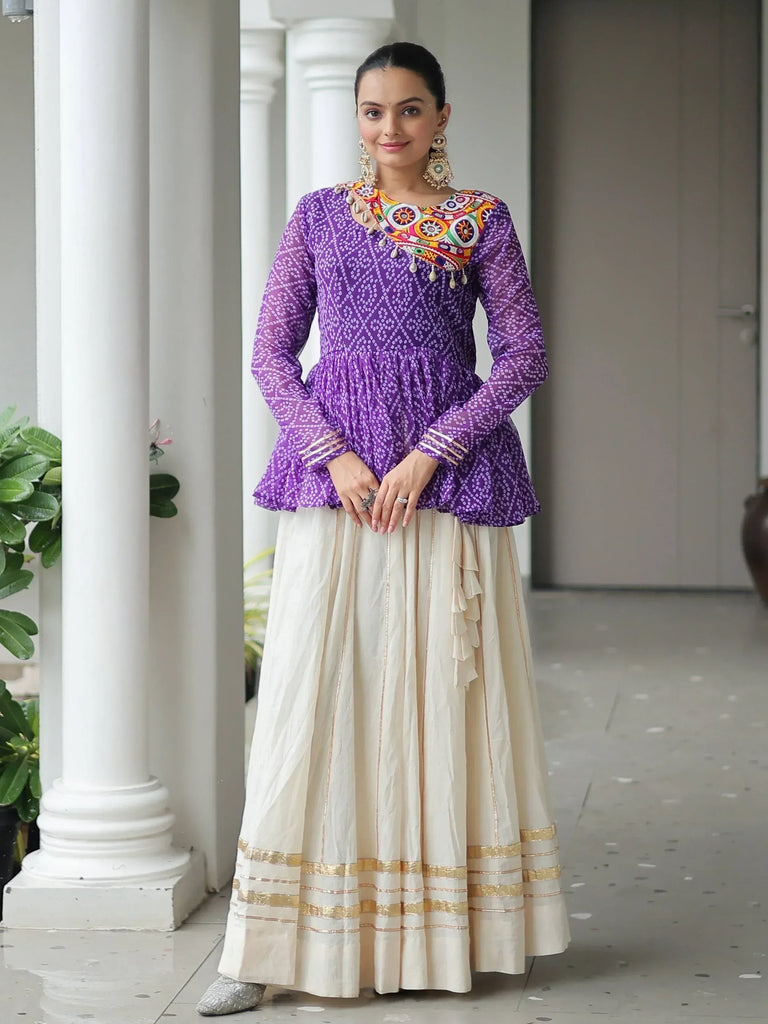 Purple printed kurta with colorful embroidery paired with cream pleated skirt, ethnic Indian wear