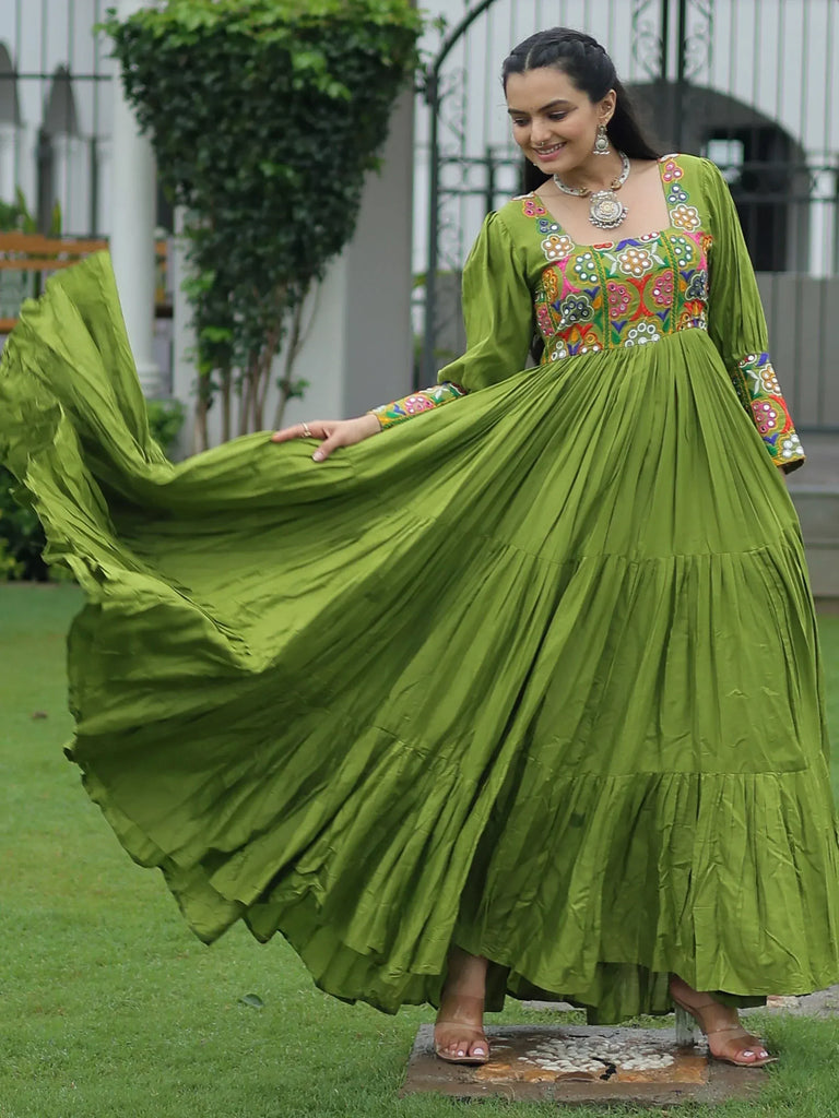 Green embroidered ethnic gown with flared skirt, perfect for festive occasions and Indian wear.