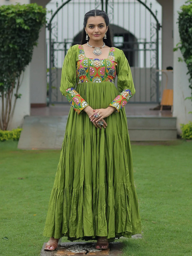 Green embroidered ethnic gown with floral mirror work, perfect for Indian festive occasions